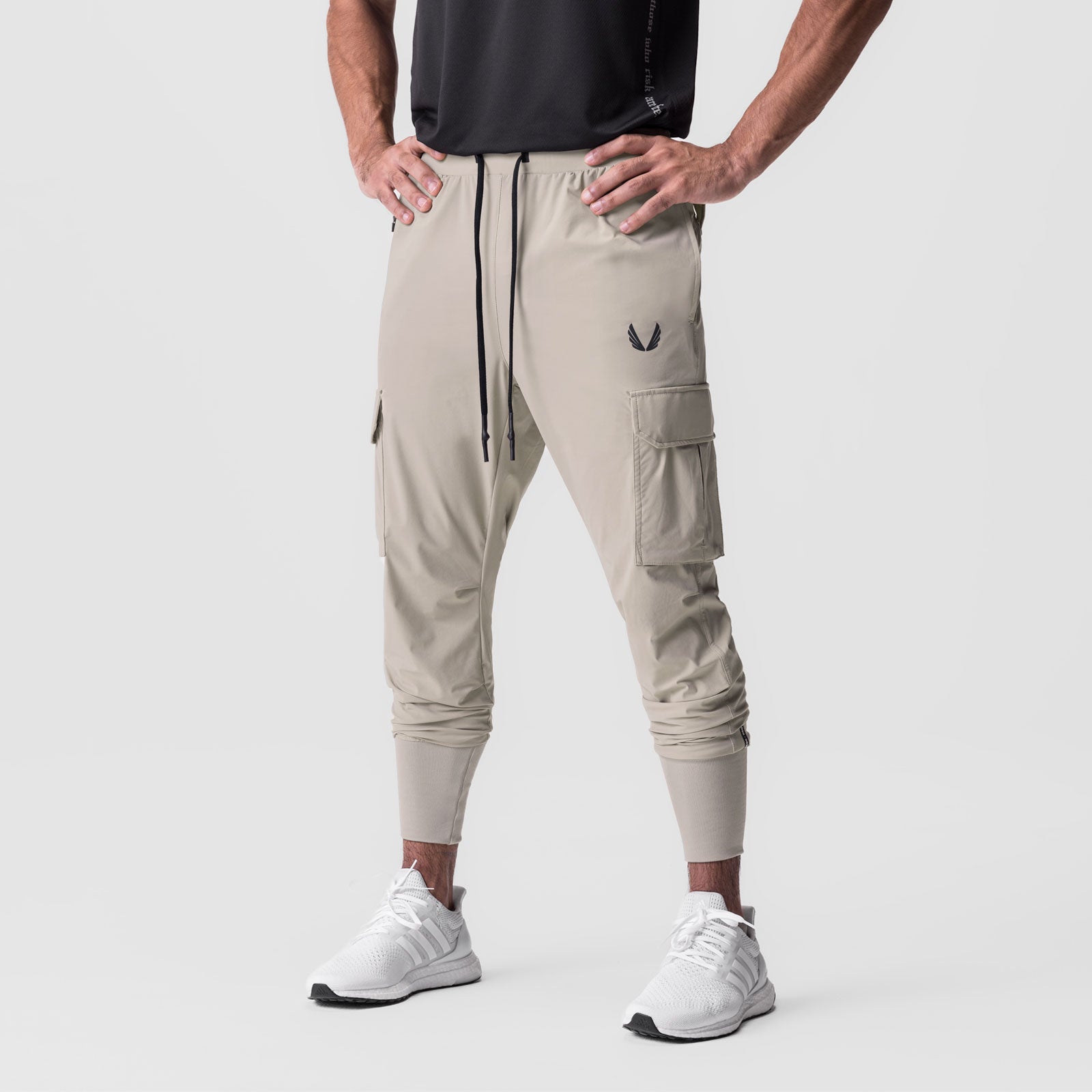 Tetra-Lite Cargo High Rib Jogger in Sand Smoke, worn by model, front view