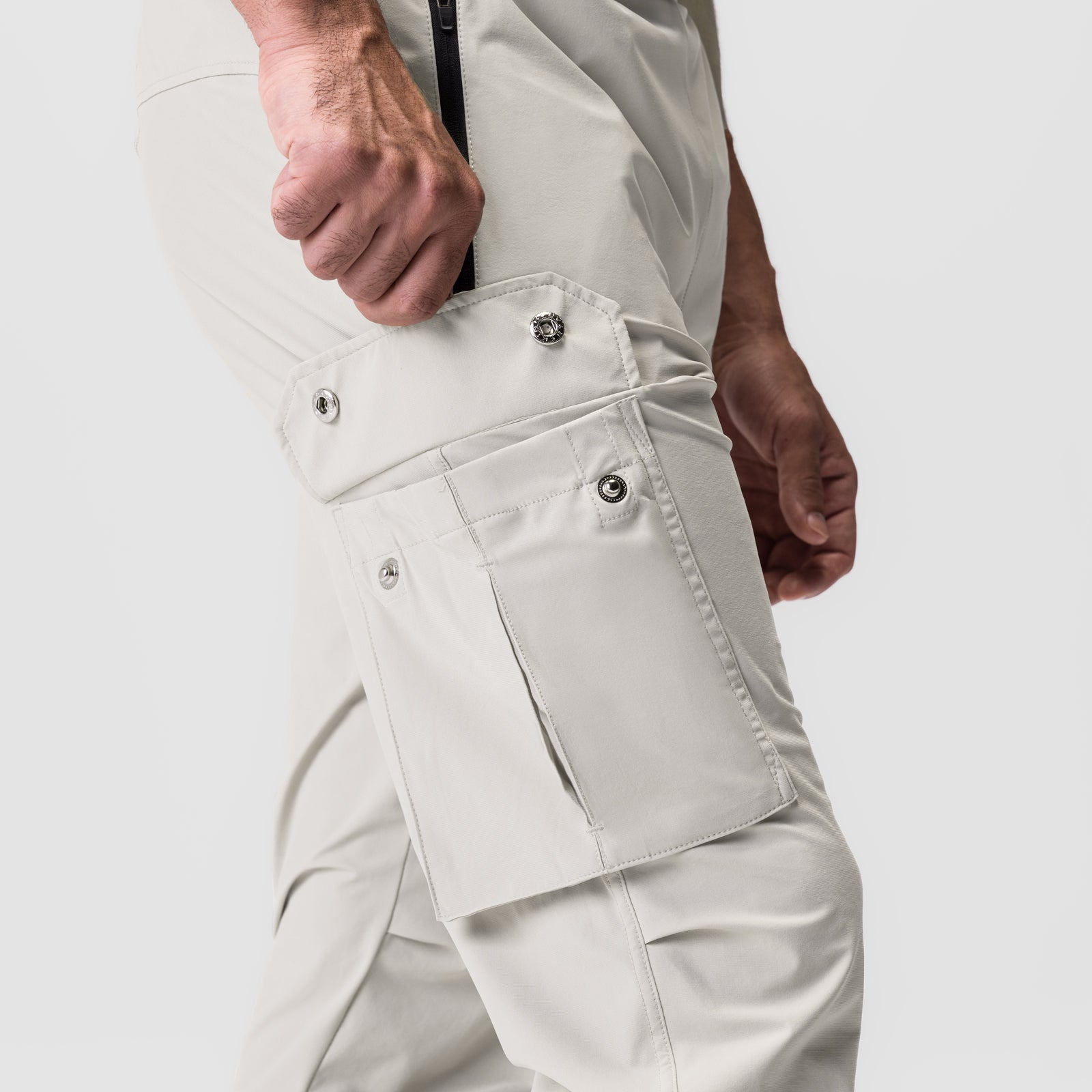 Tetra-Lite Cargo High Rib Jogger in stone, worn by model showing cargo pocket detail