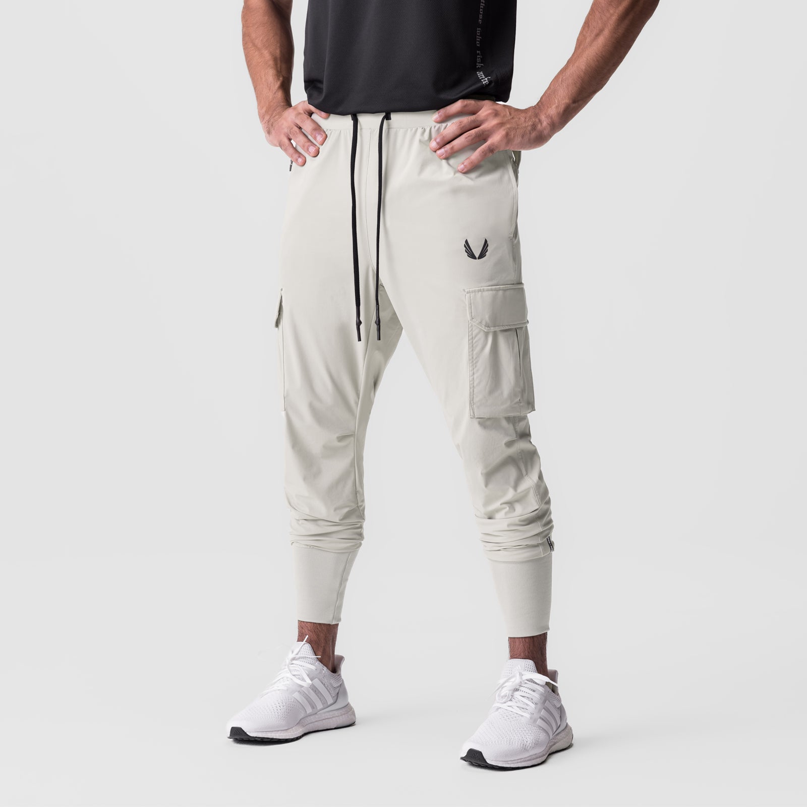 Tetra-Lite Cargo High Rib Jogger in stone, worn by model standing, front view