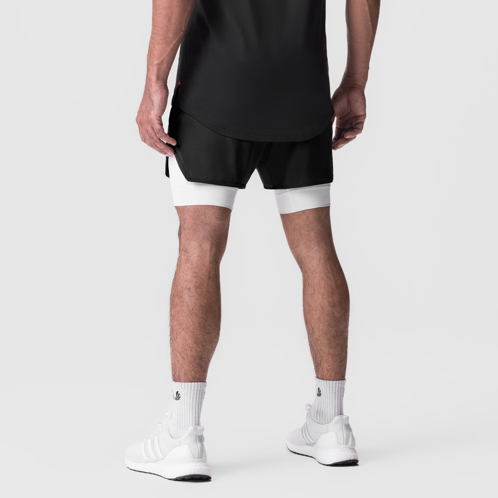 AeroSilver 5" Liner Short in black with white panels, rear view on model