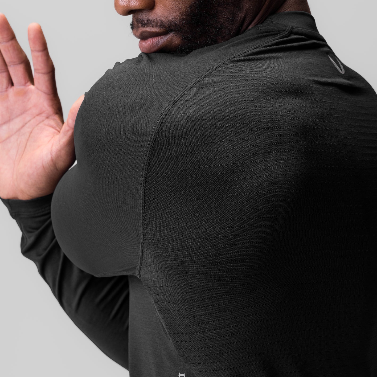 Black 3D-Lite 2.0 fitted long sleeve worn by model, rear view with hand raised