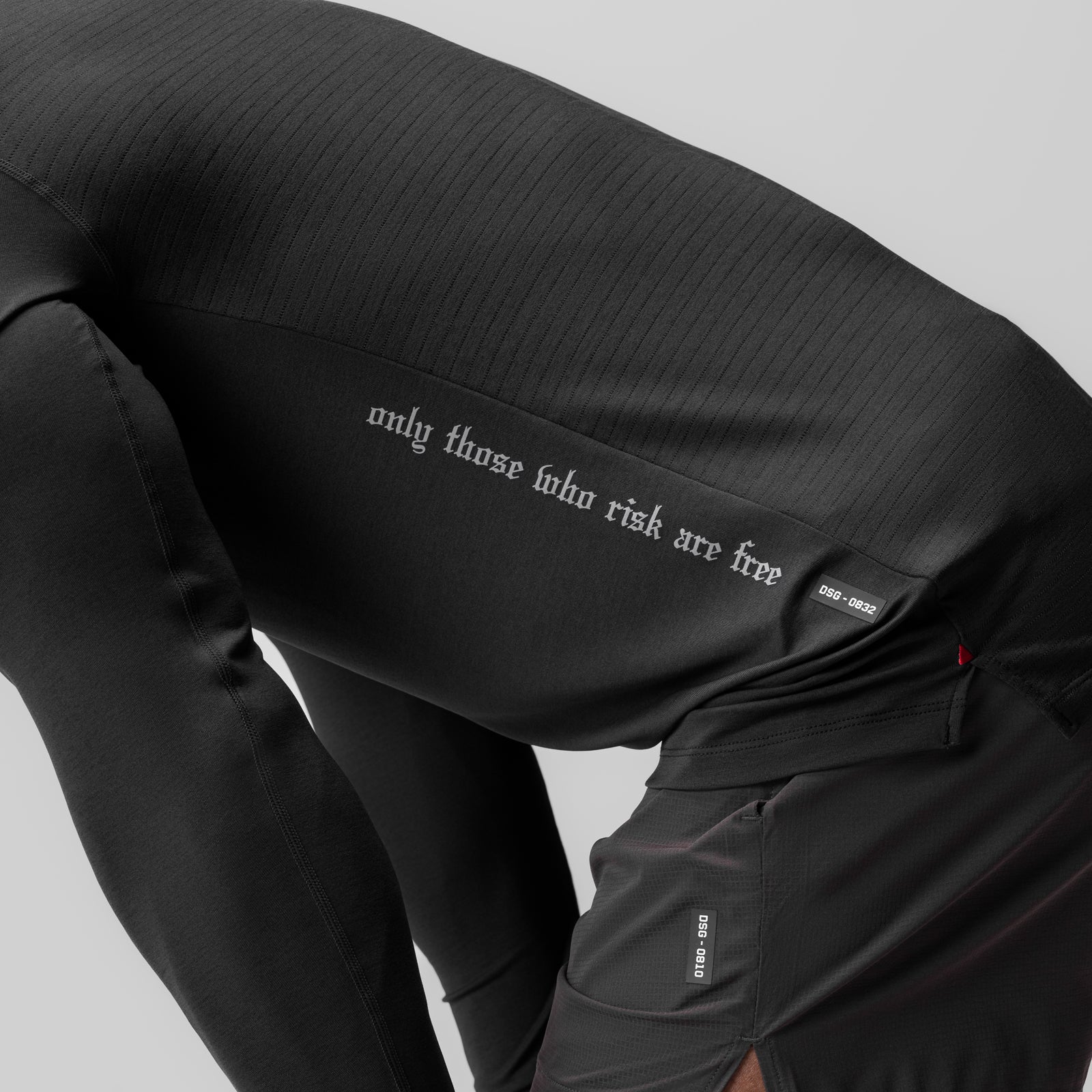 0832. 3D-Lite® 2.0 Fitted Long Sleeve in black with model wearing, detail of text on sleeve