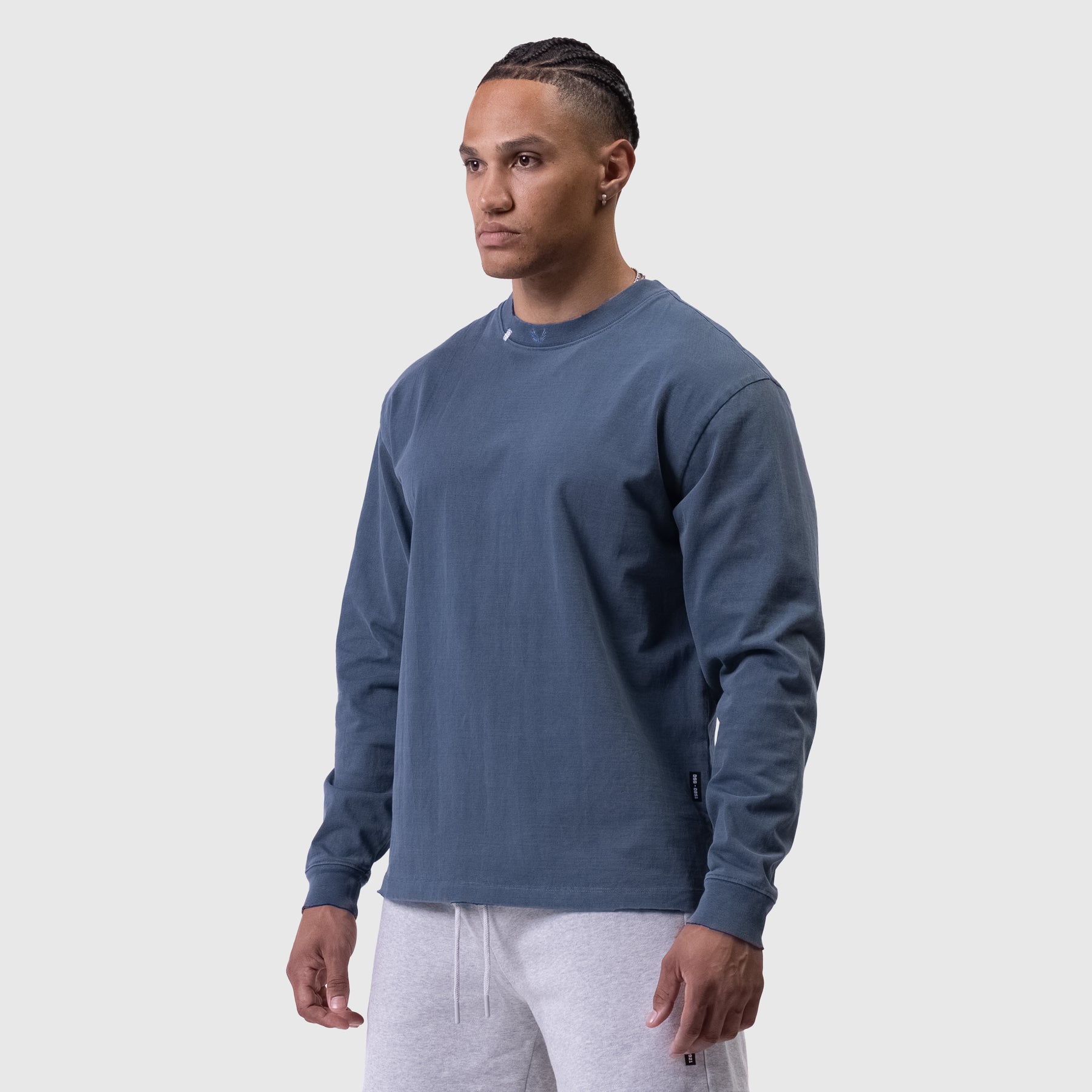 Tech Essential Relaxed Long Sleeve in faded navy worn by model, front view