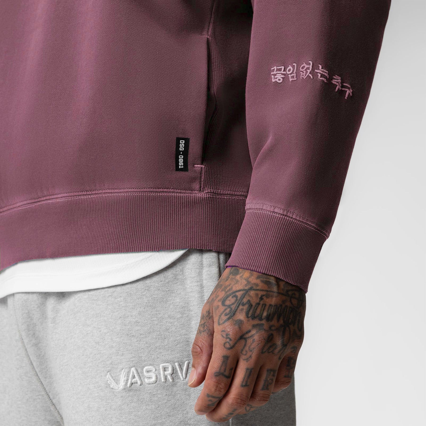 Tech Essential Distressed Crewneck in Faded Crimson worn by model, close-up detail view