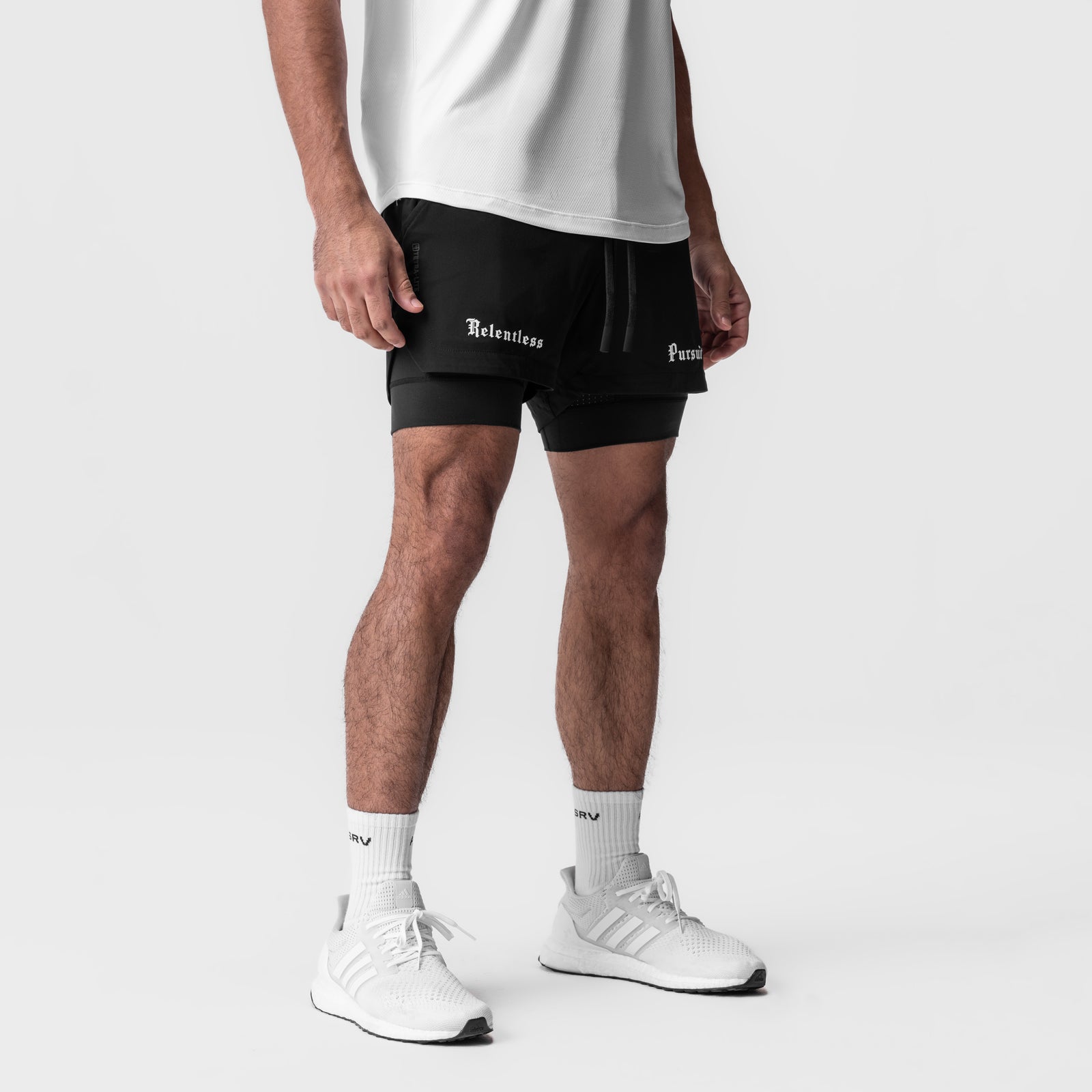 Tetra-Lite 5" Liner Short in black, worn by model with white tee and sneakers