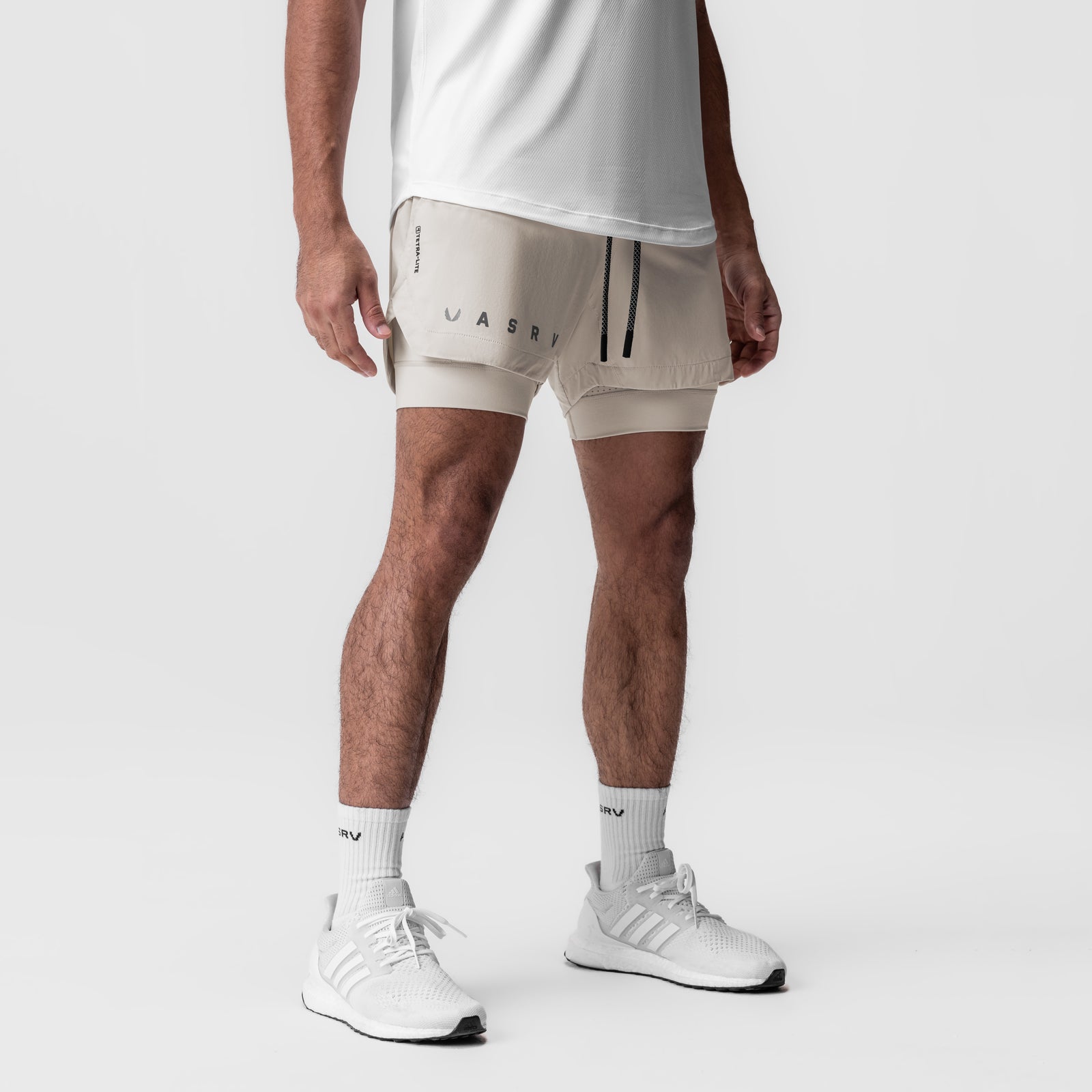 Tetra-Lite 5" Liner Short in Chai, modeled with white sneakers and socks, front view