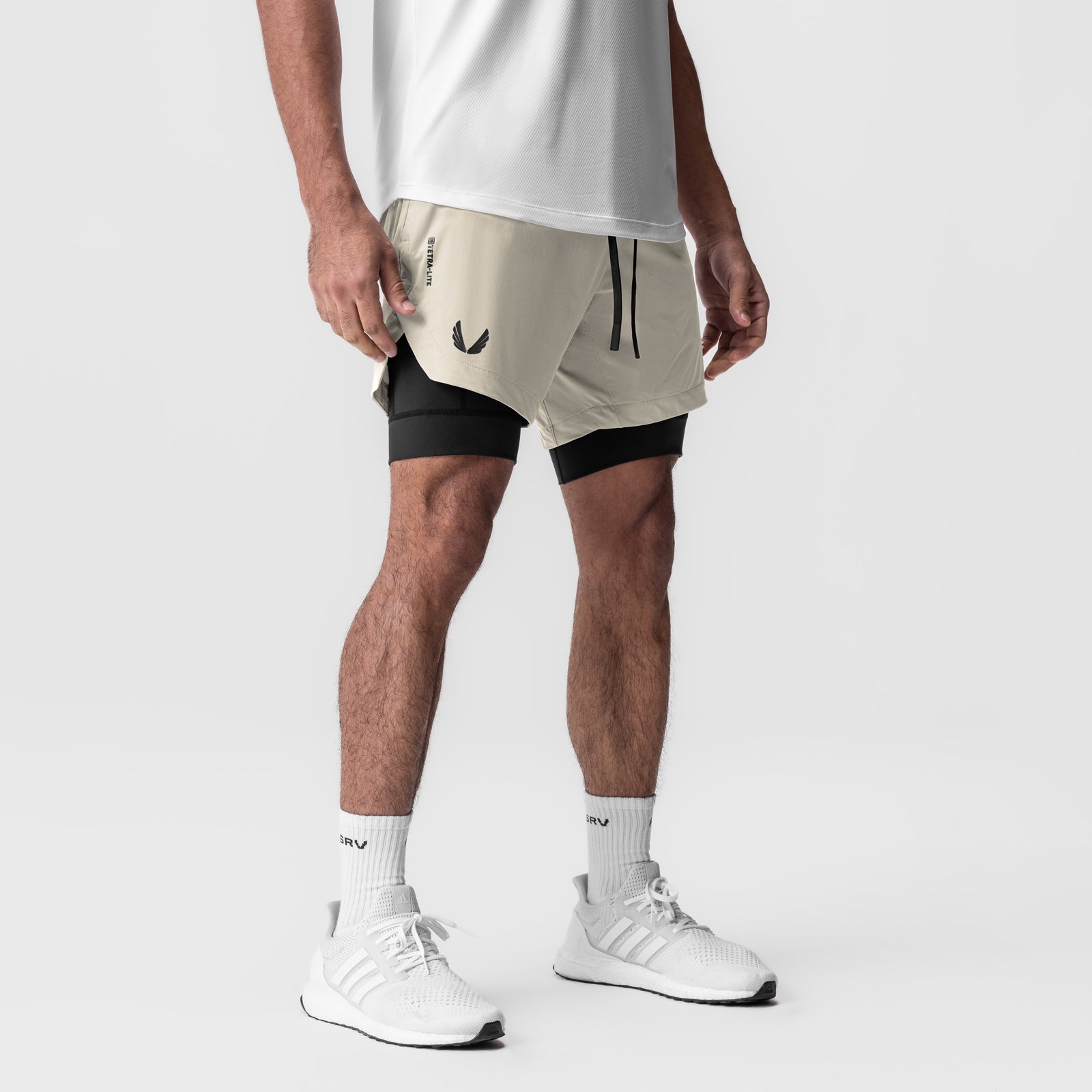 Tetra-Lite 5" Liner Short in Stone and Black, worn by model, front view