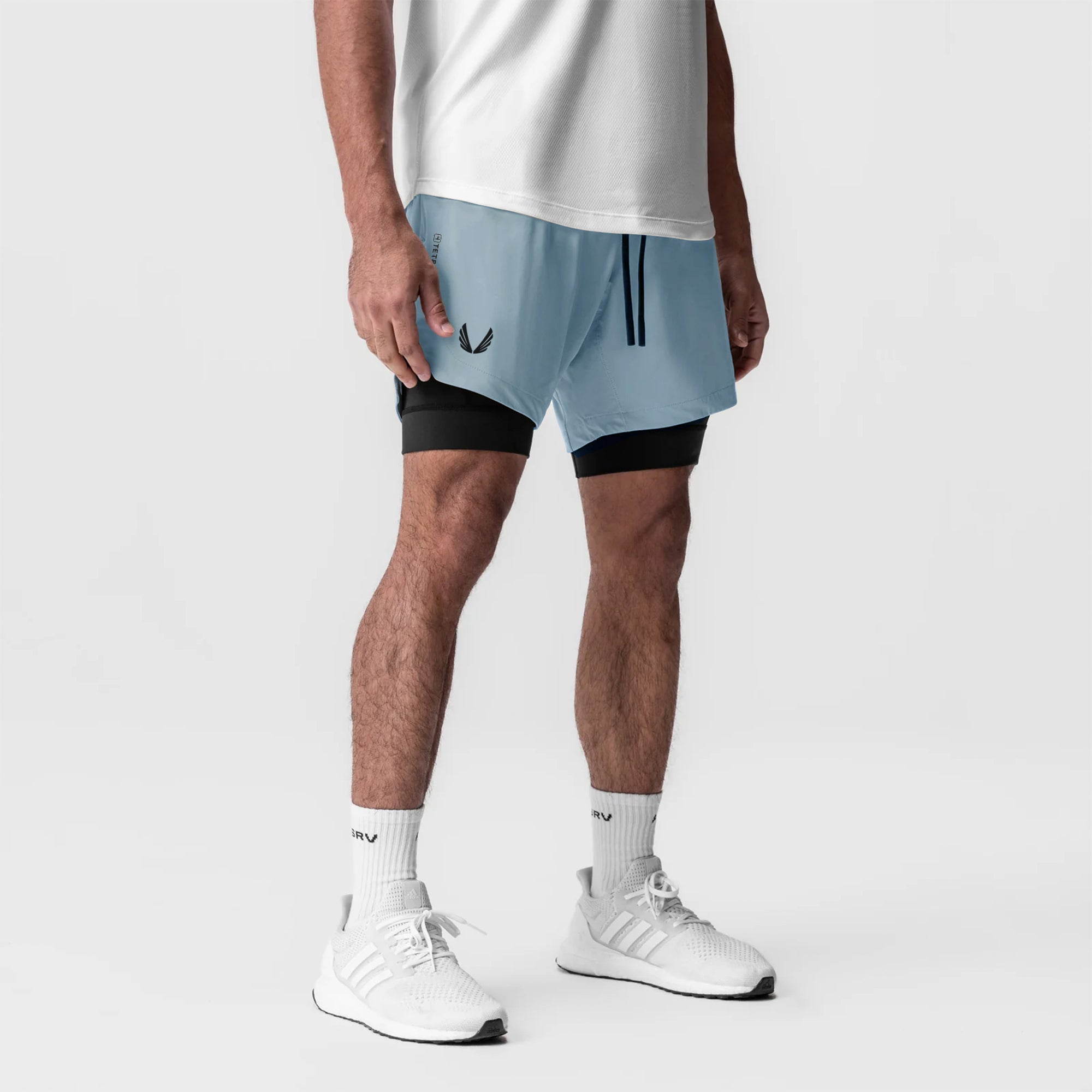Tetra-Lite 7" Liner Short in Light Sky and Black, worn by model with white socks and sneakers