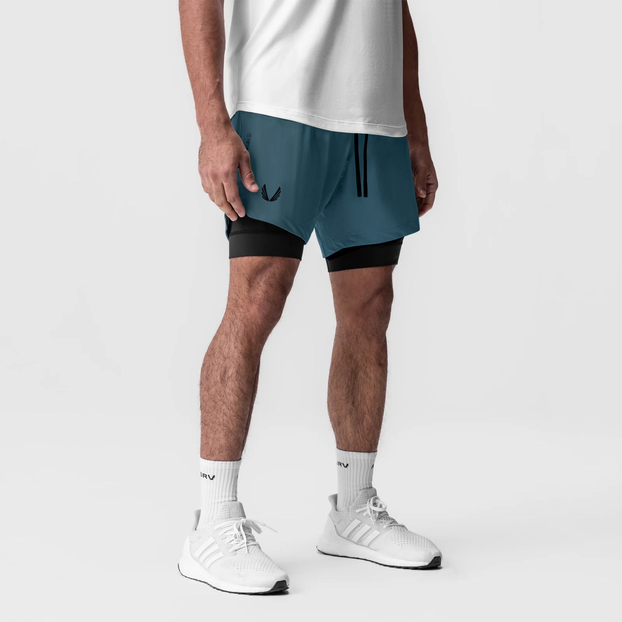 Tetra-Lite 7" Liner Short in Storm/Black worn with white socks and sneakers, front view