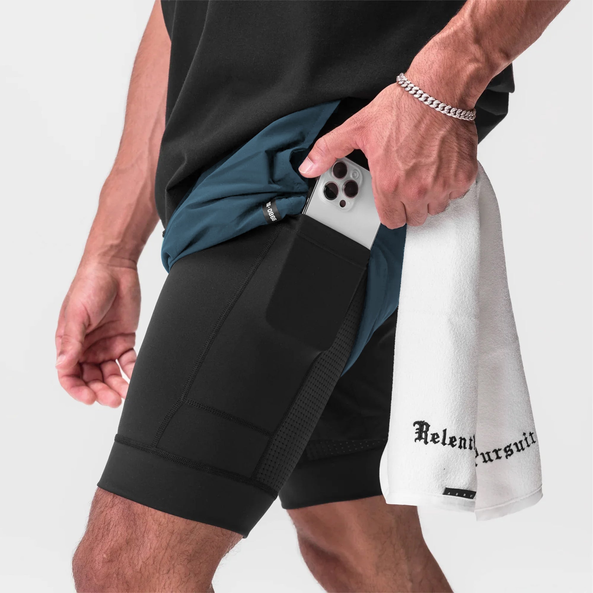 Tetra-Lite 7" Liner Short in Storm Blue and Black, model wearing shorts with phone in pocket