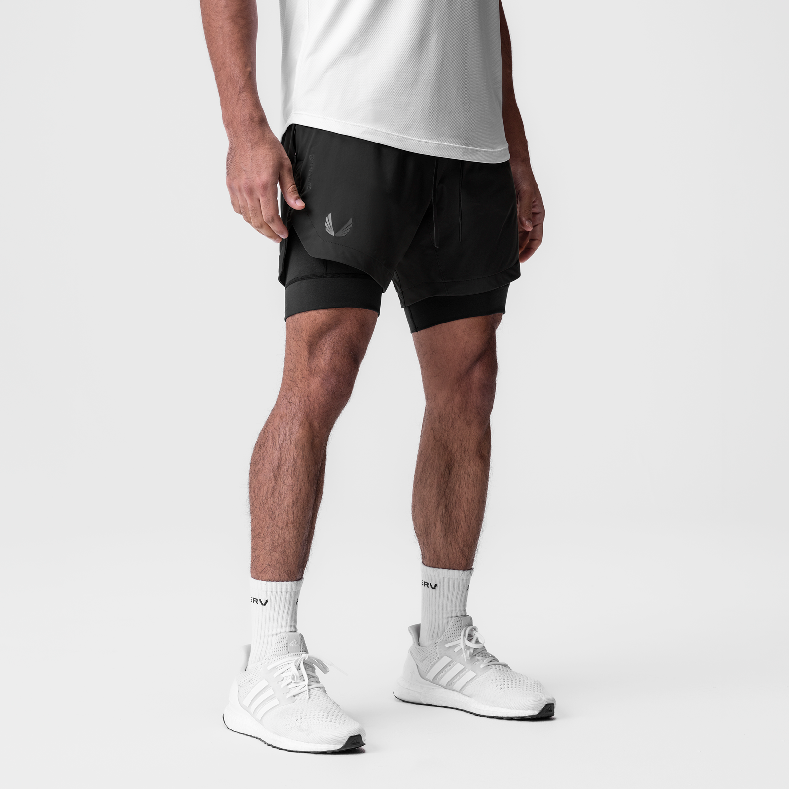Tetra-Lite 7" Liner Short in black, worn by model with white socks and sneakers