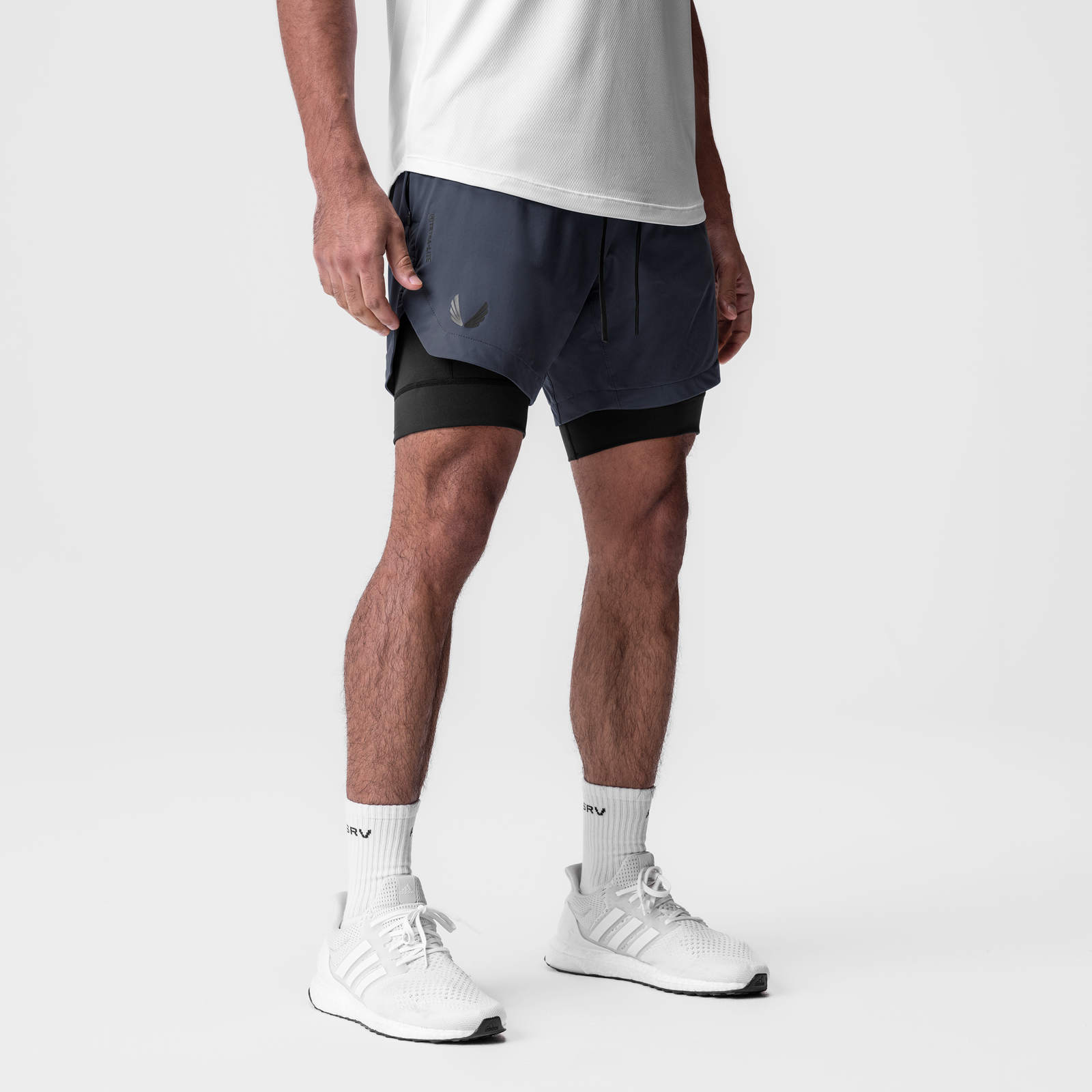 Tetra-Lite 7" Liner Short in navy and black, worn by model, front view