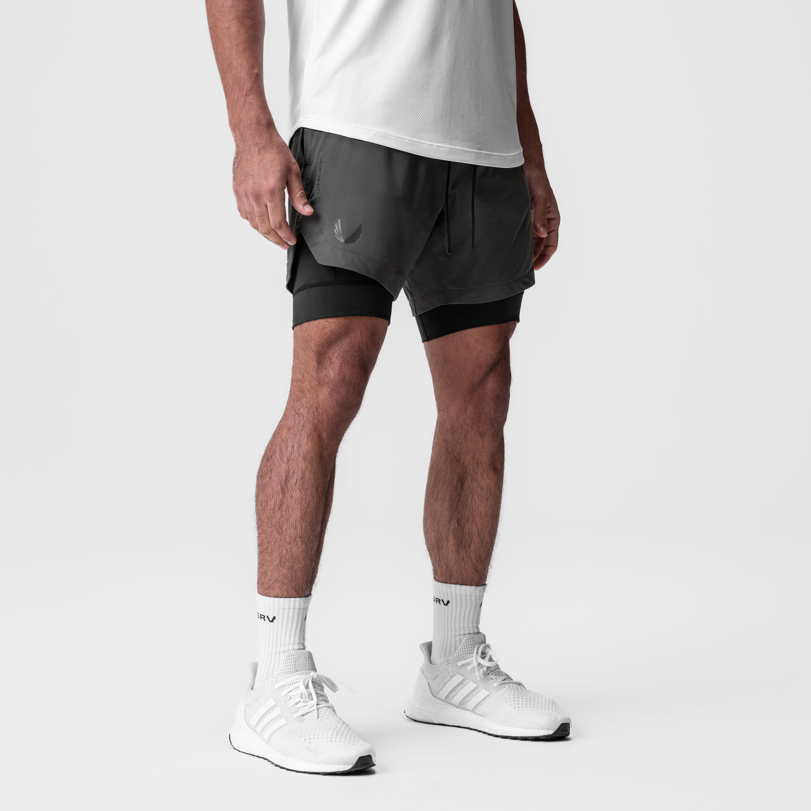 Tetra-Lite 7" Liner Short in Space Grey and Black, worn with white socks and sneakers