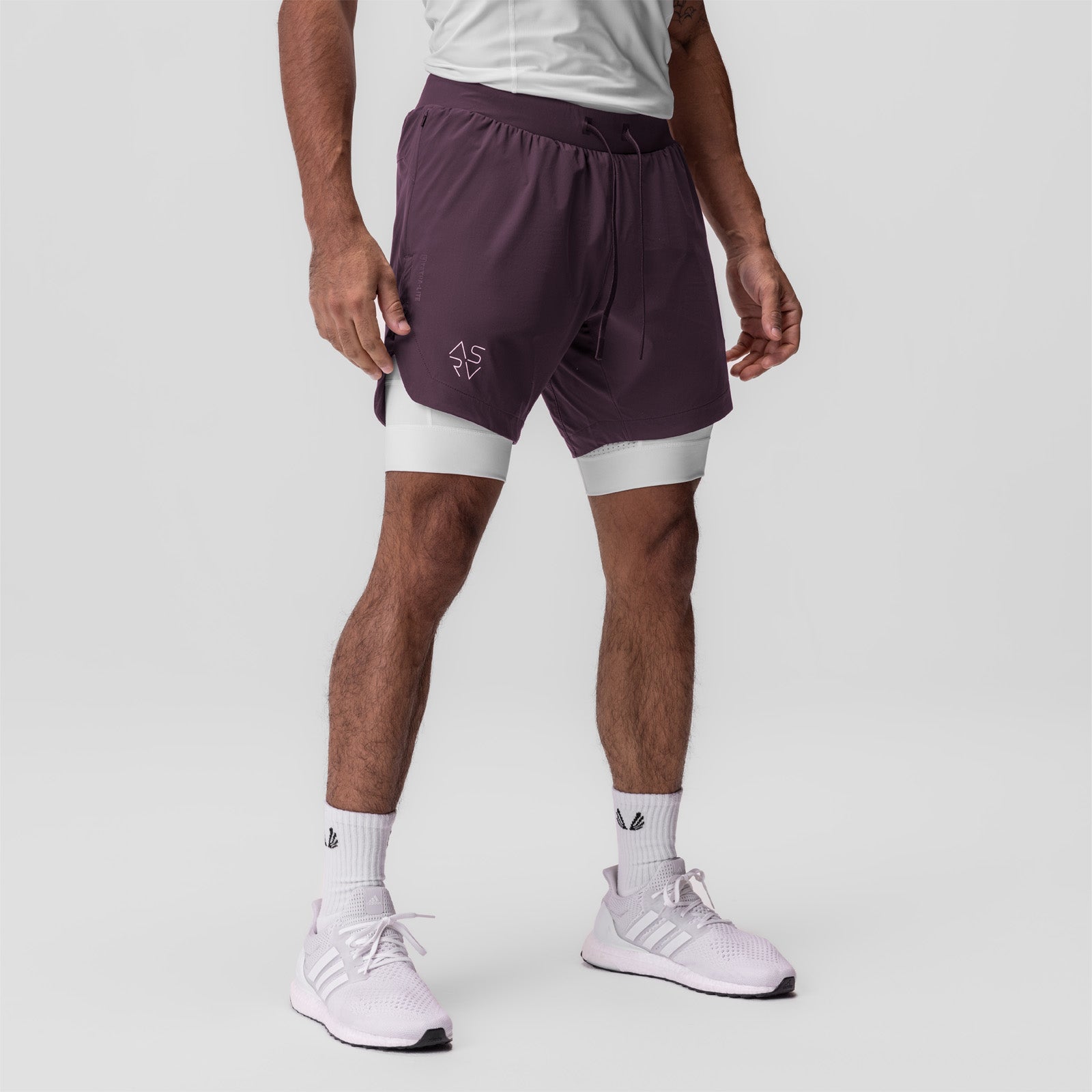 Tetra-Lite 7" Liner Short in Deep Purple and White, worn by model standing