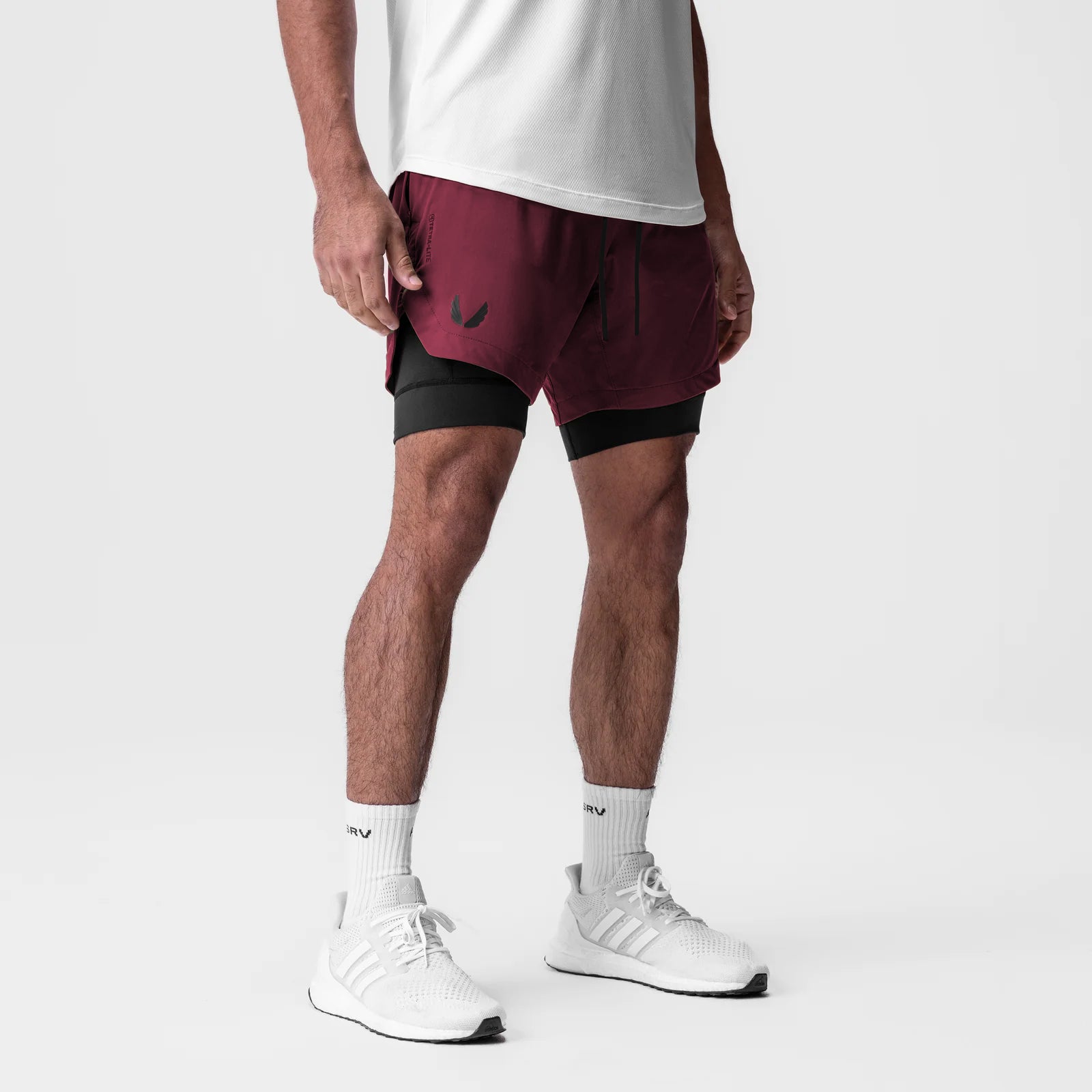 Tetra-Lite 7" Liner Short in Crimson and Black, worn with white sneakers and socks