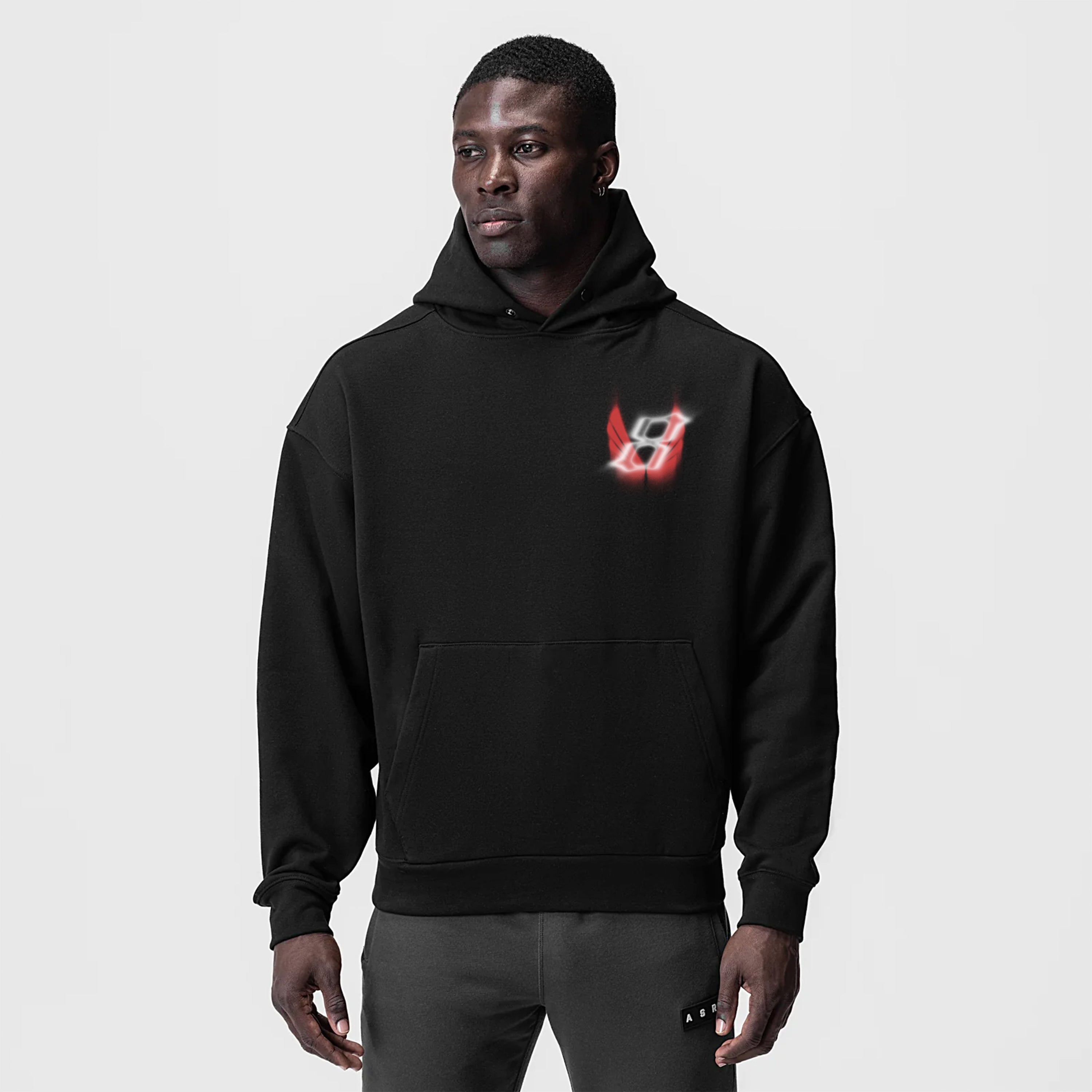 Tech-Terry Zip Pocket Hoodie in black with red logo, worn by model, front view