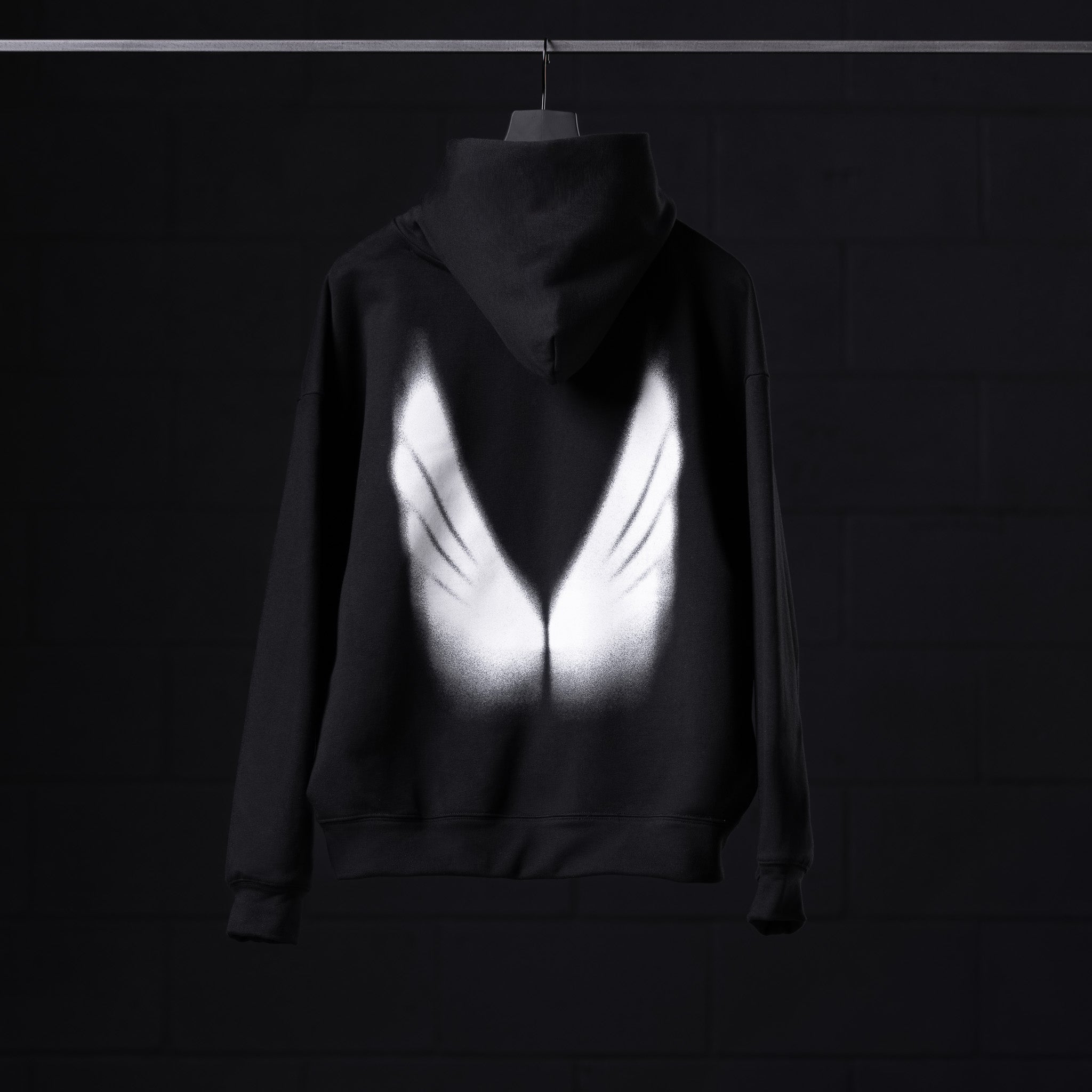 Flatlay Tech-Terry Zip Pocket Hoodie in black with white graphic design on chest