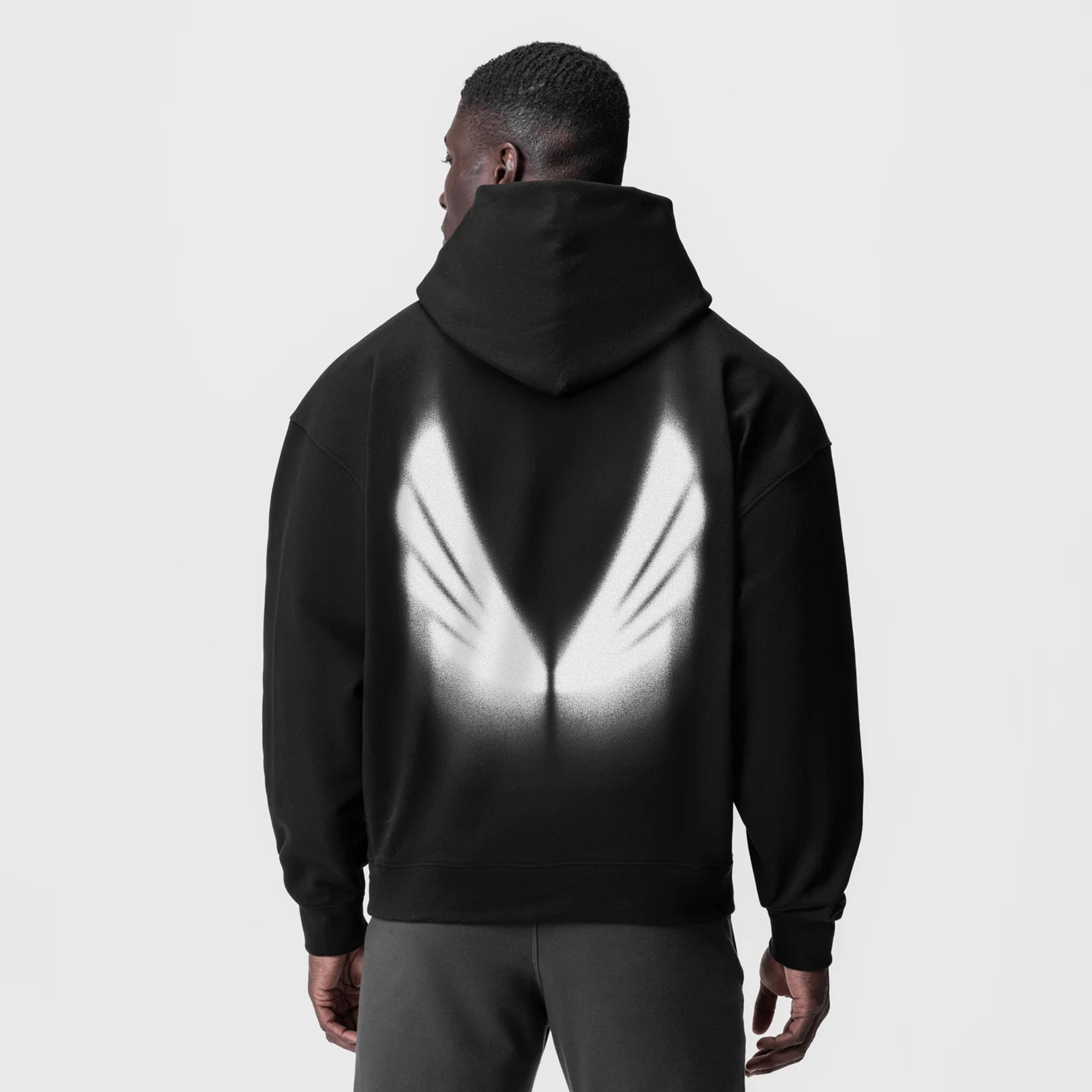 Tech-Terry Zip Pocket Hoodie in black with reflective graphic, back view on model