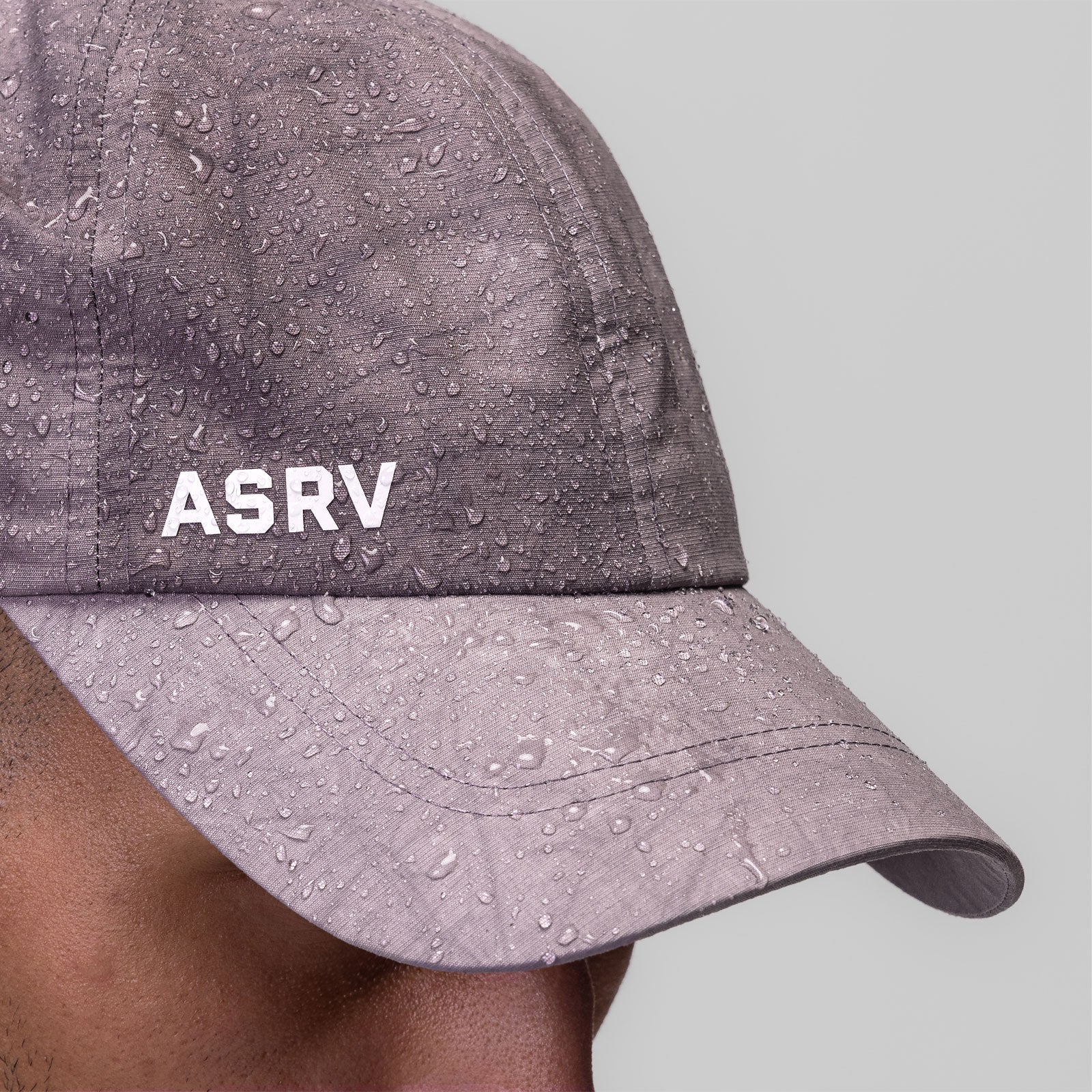 Weather-Ready Cinch Hat in Moonscape Wave Dye worn on model, side view