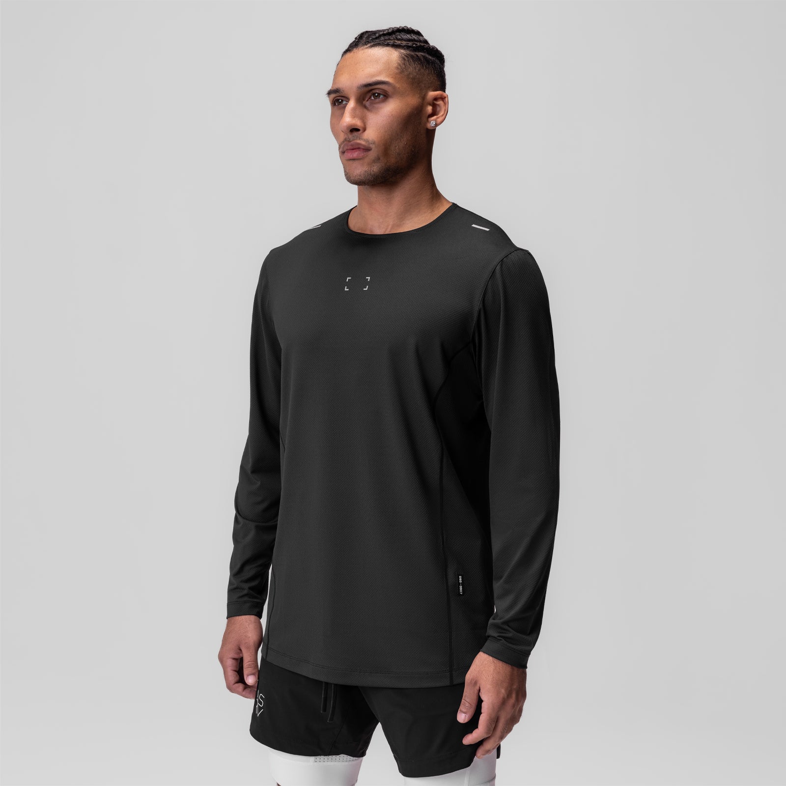 AeroSilver Training Long Sleeve in black with Space Bracket logo, worn by model facing forward