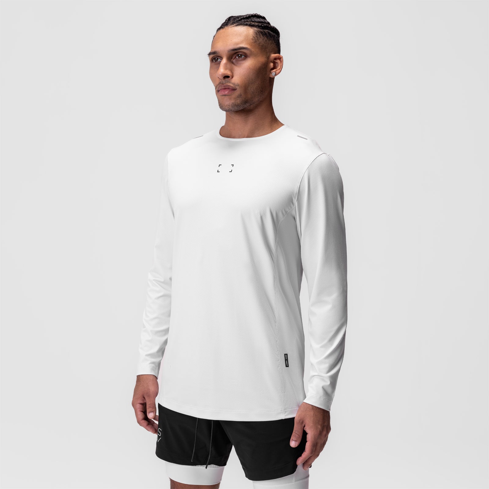 AeroSilver Training Long Sleeve in white with Space Bracket logo, worn by model with black shorts