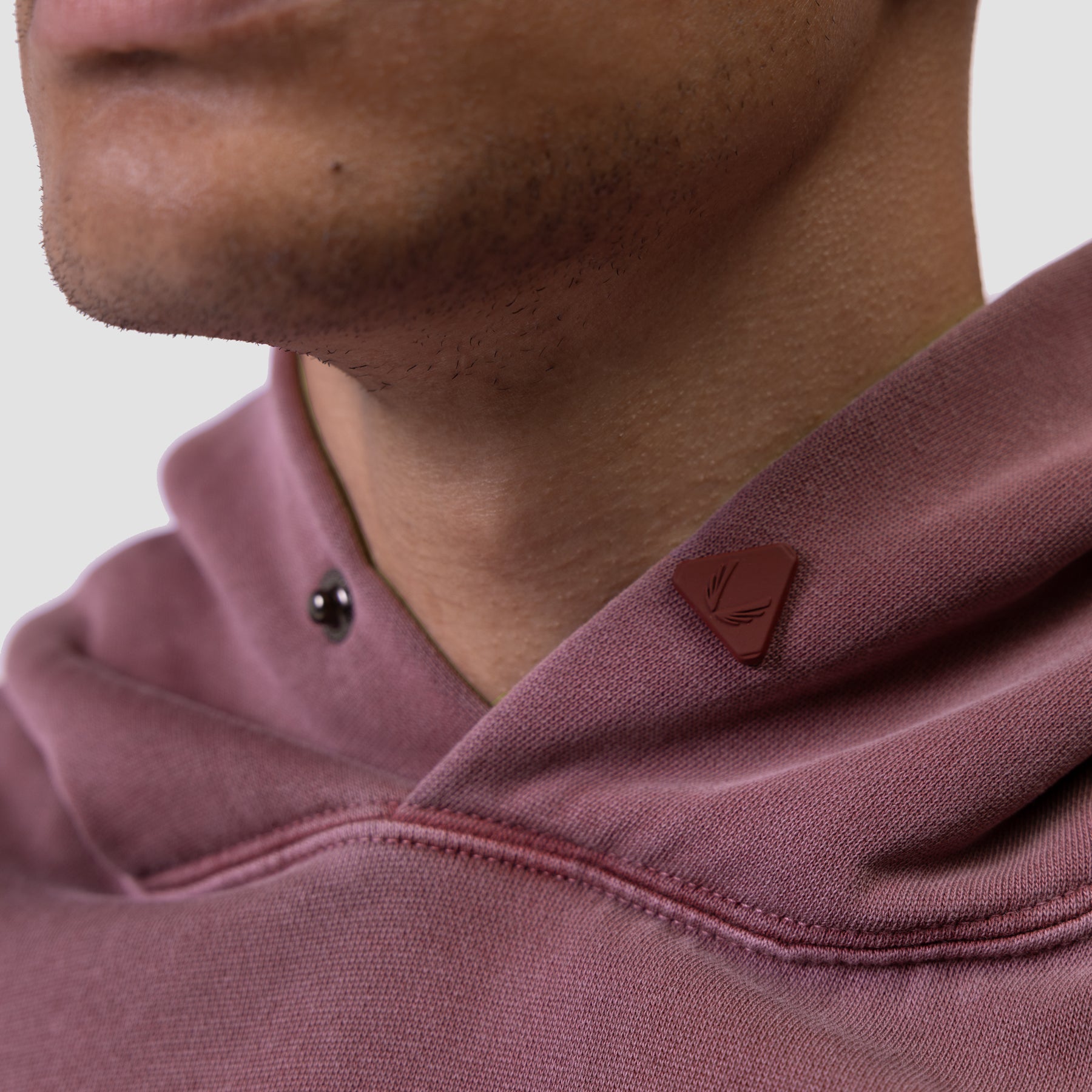 Tech Essential Distressed Hoodie in Faded Crimson worn by model, closeup detail view