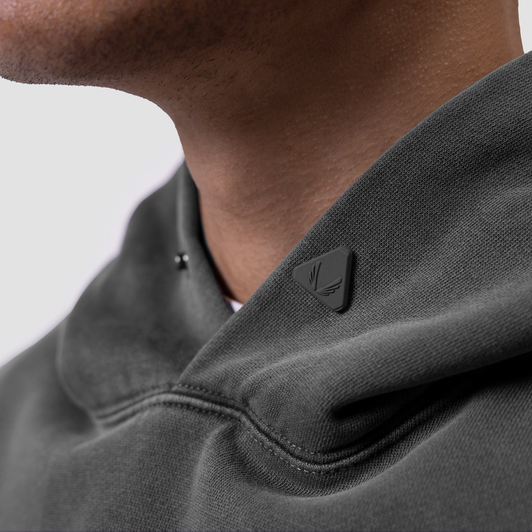 Tech Essential Distressed Hoodie in Faded Grey, worn by model, shoulder detail view