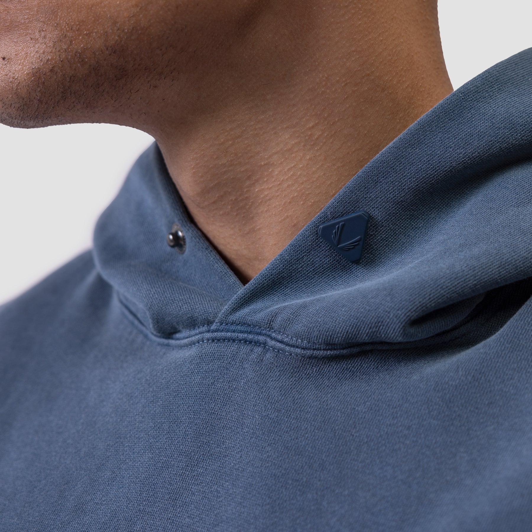 Tech Essential Distressed Hoodie in Faded Navy worn by model, close-up detail shot