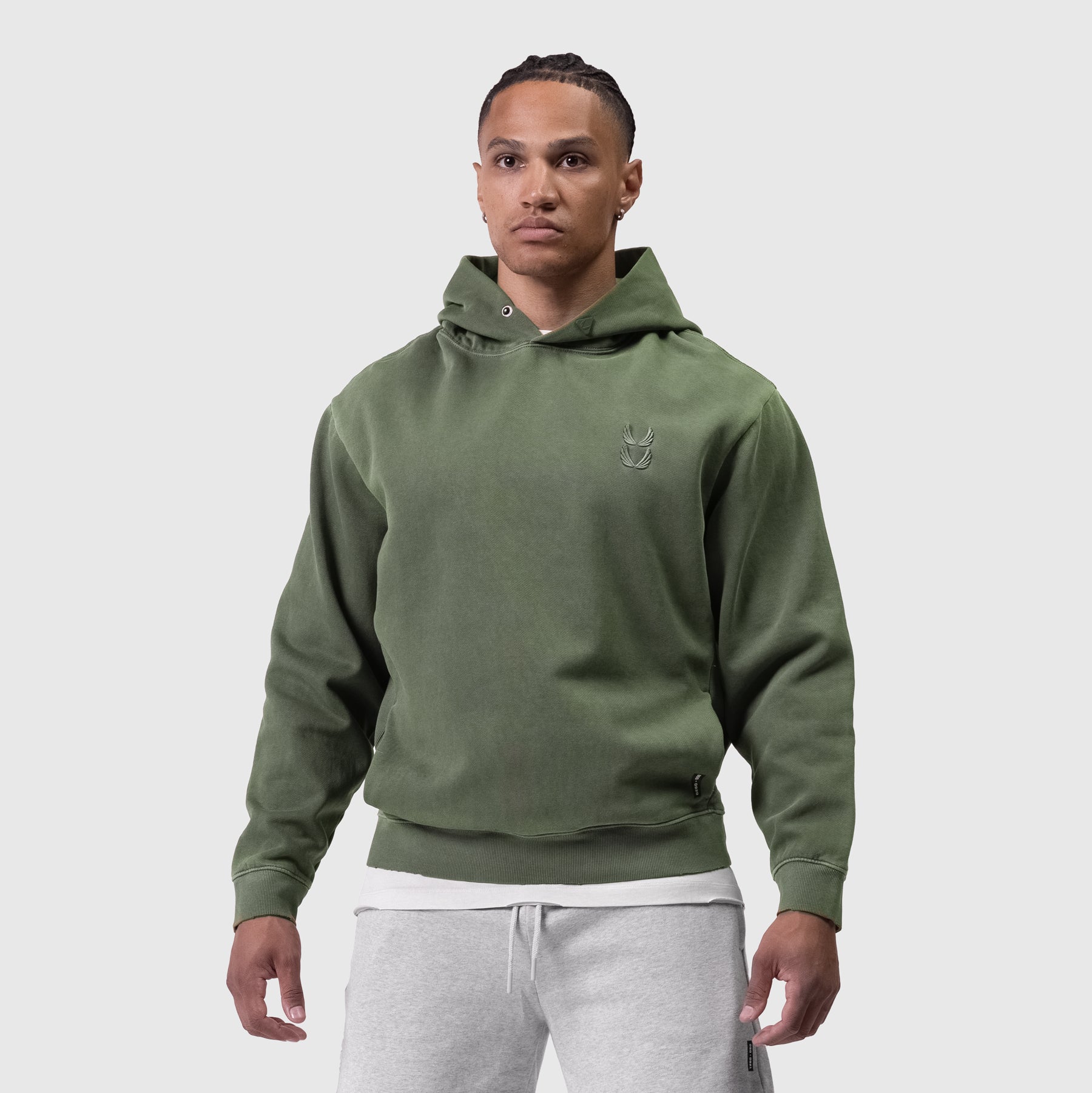 Tech Essential Distressed Hoodie in faded olive worn by model, front view