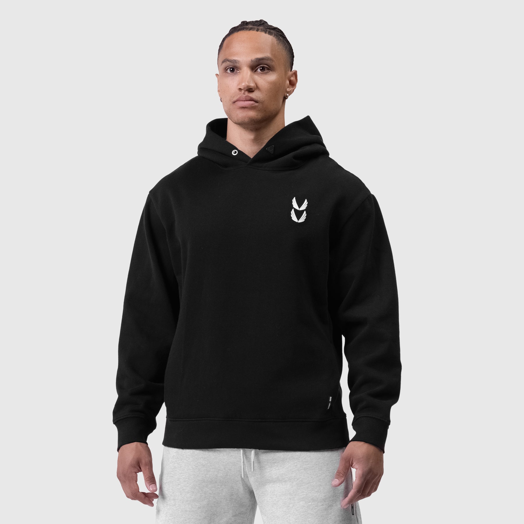 Black Tech Essential Distressed Hoodie worn by model, front view