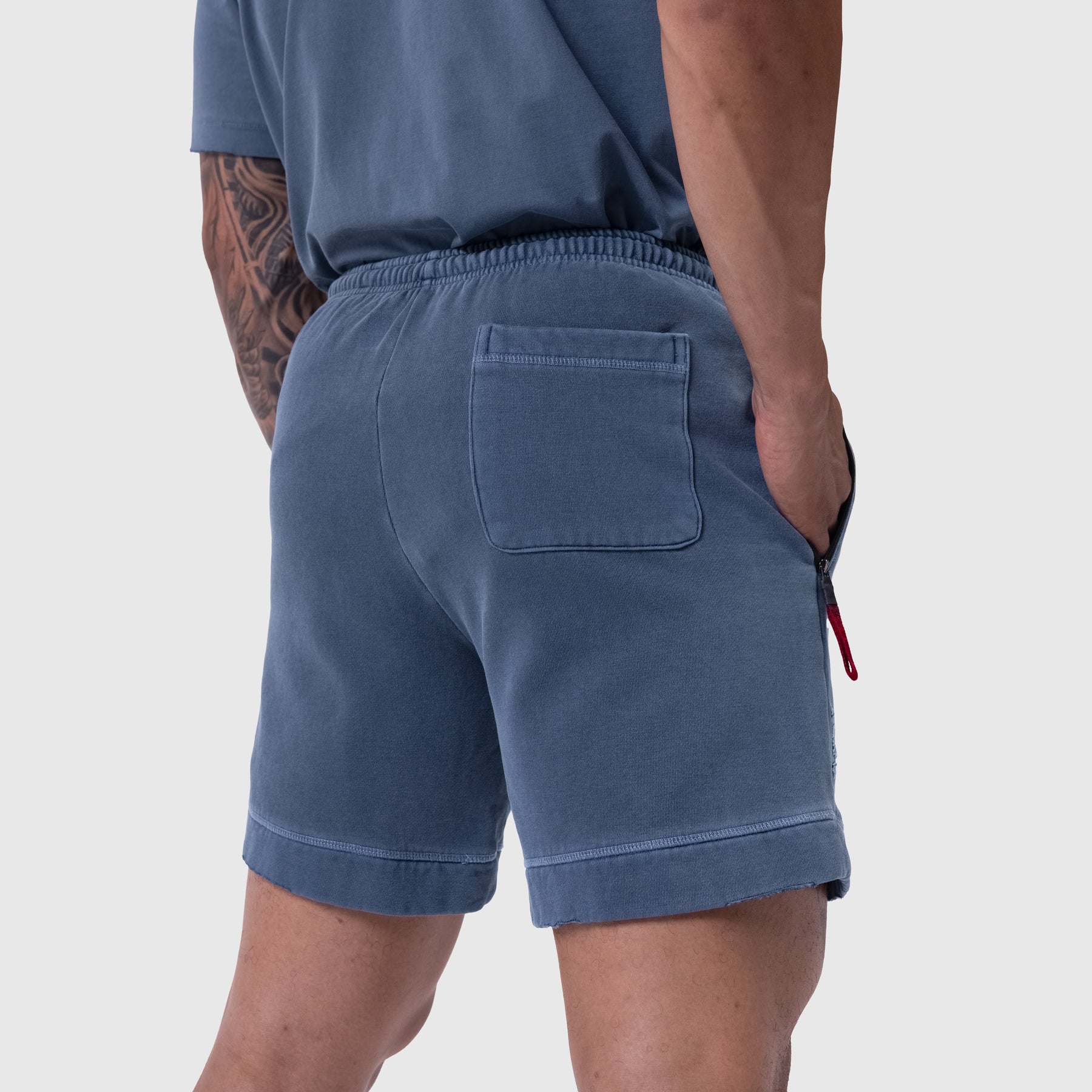 Tech Essential Sweat Short in Faded Navy worn by model, back view