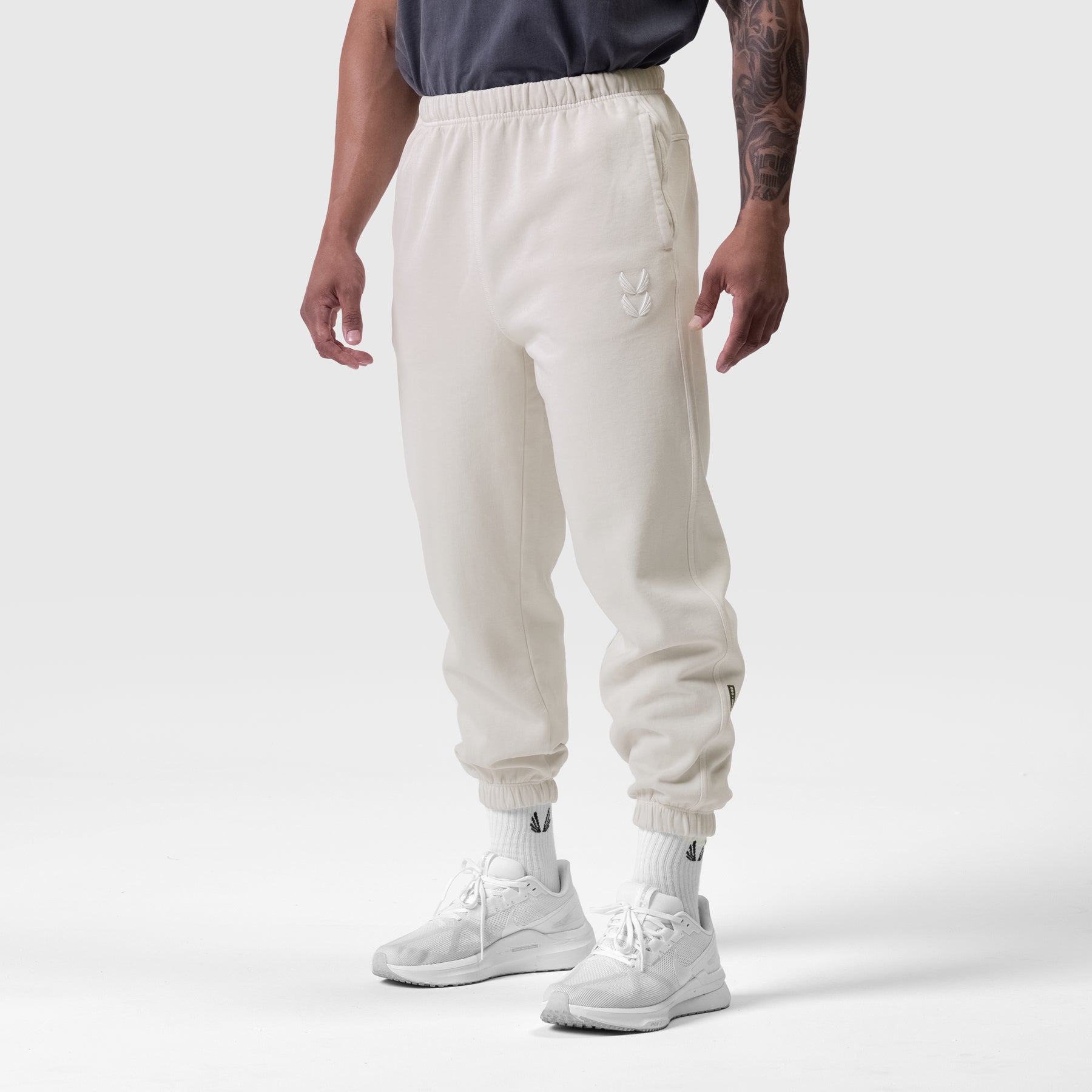 Tech Essential™ Sweats in cream, worn by model standing against white background
