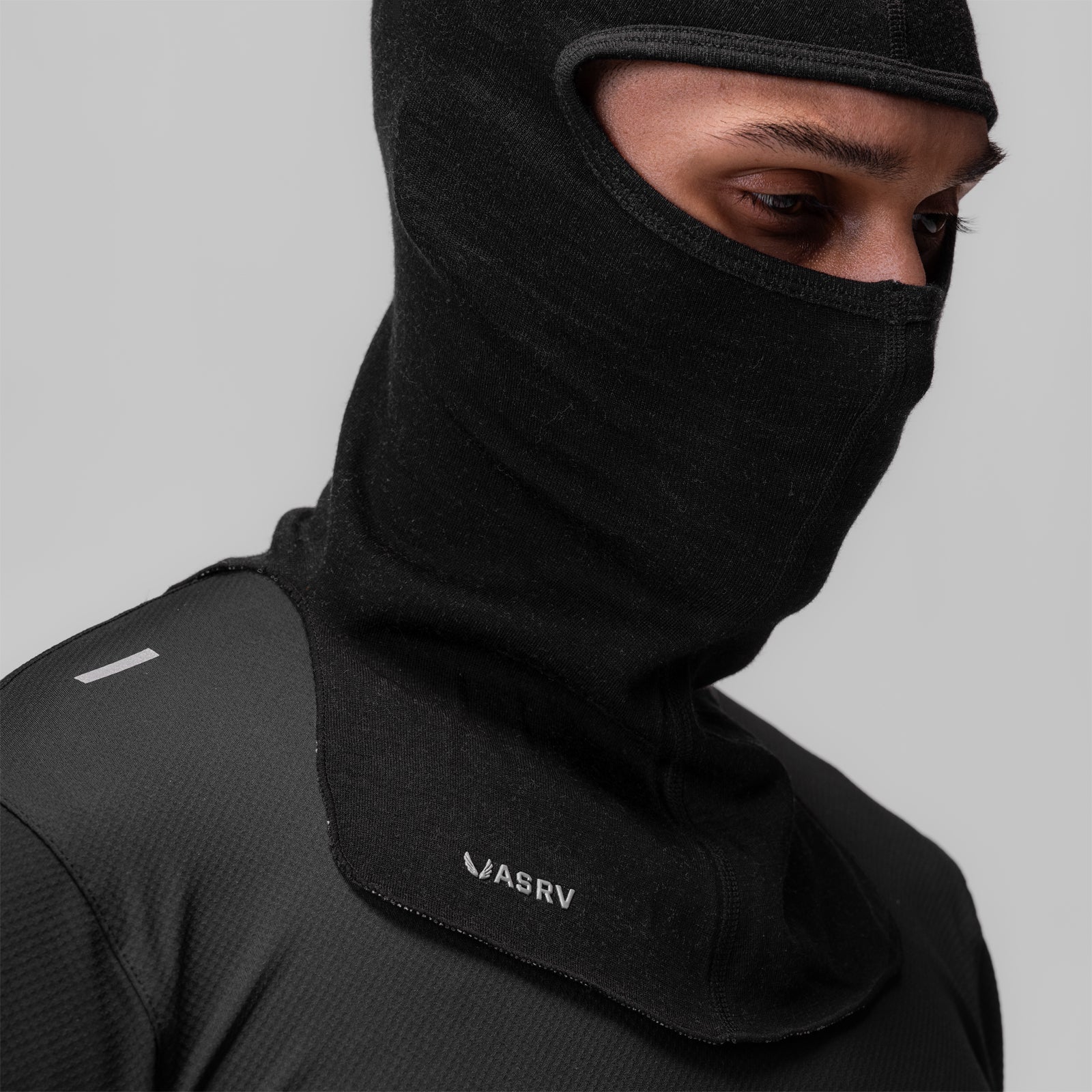 Merino Wool Balaclava in black, worn by model showing face coverage