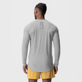 Laser-Vent Established Long Sleeve in slate grey, back view on model with yellow shorts
