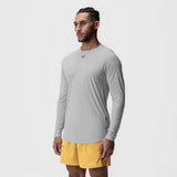Laser-Vent™ Established Long Sleeve in Slate Grey, modeled with yellow shorts, side view