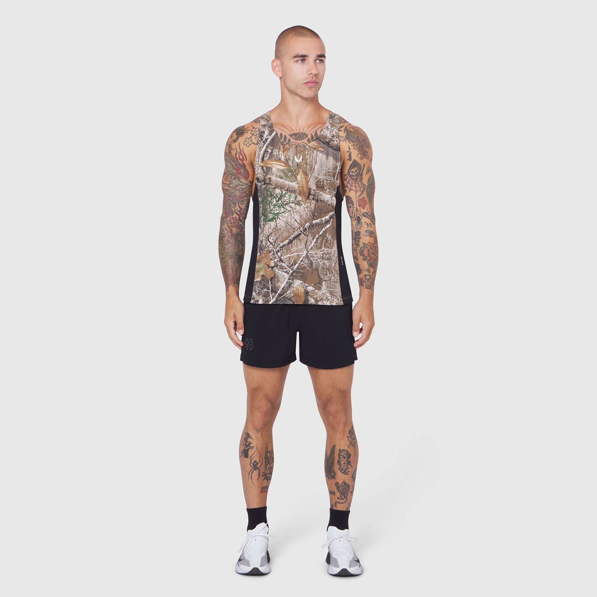Laser-Vent Singlet Tank in Realtree Edge camo, worn by model with tattoos, front view