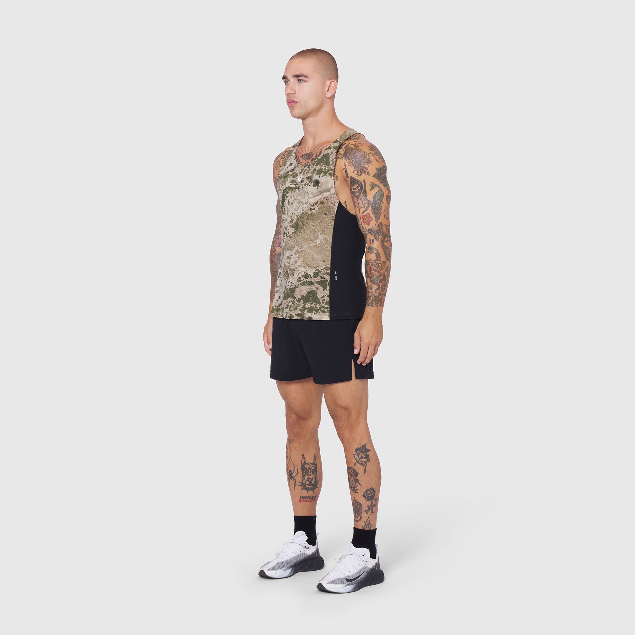Laser-Vent Singlet Tank in camo and black, worn by model in side profile