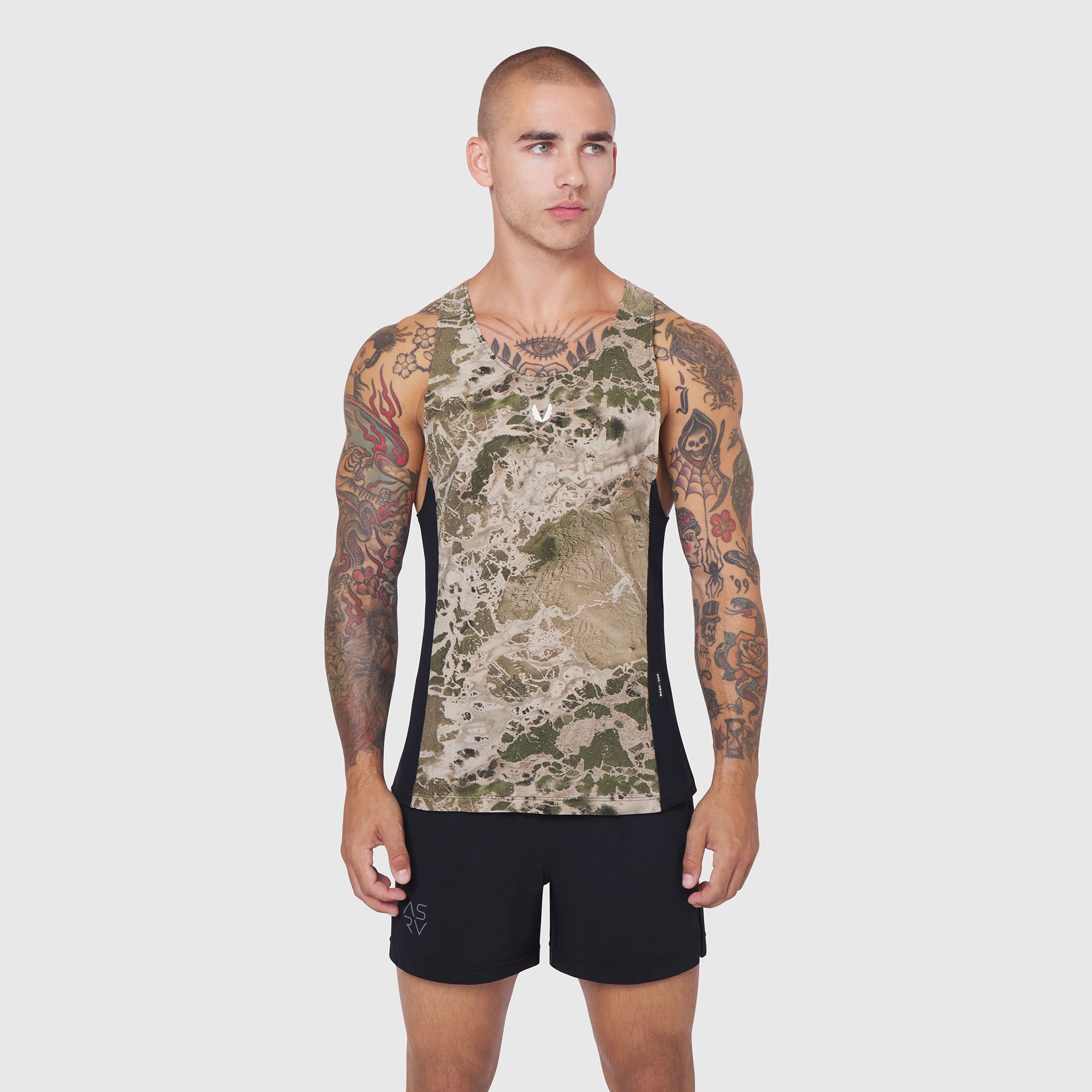 Laser-Vent Singlet Tank in camo with black sides, worn by model facing forward