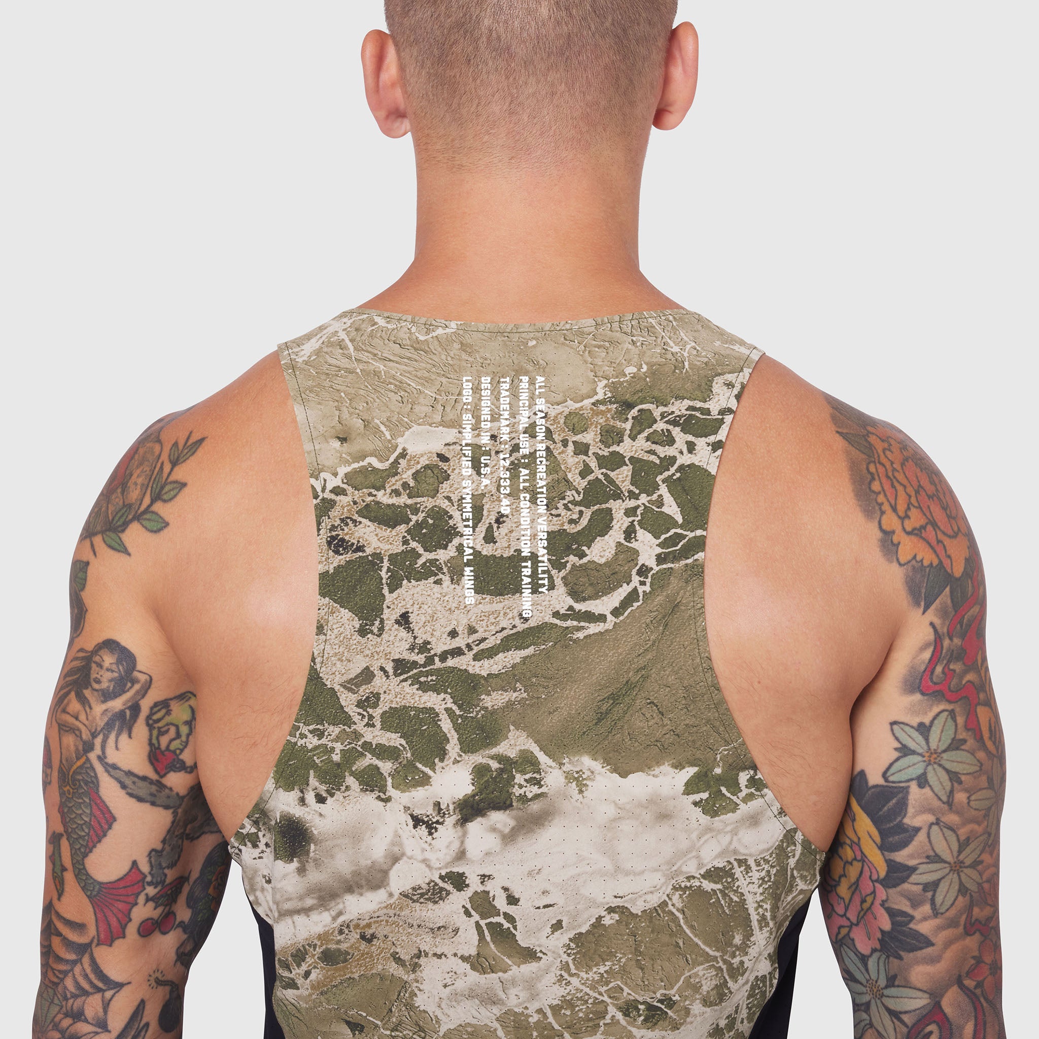Laser-Vent Singlet Tank in sage camo, back view on tattooed model
