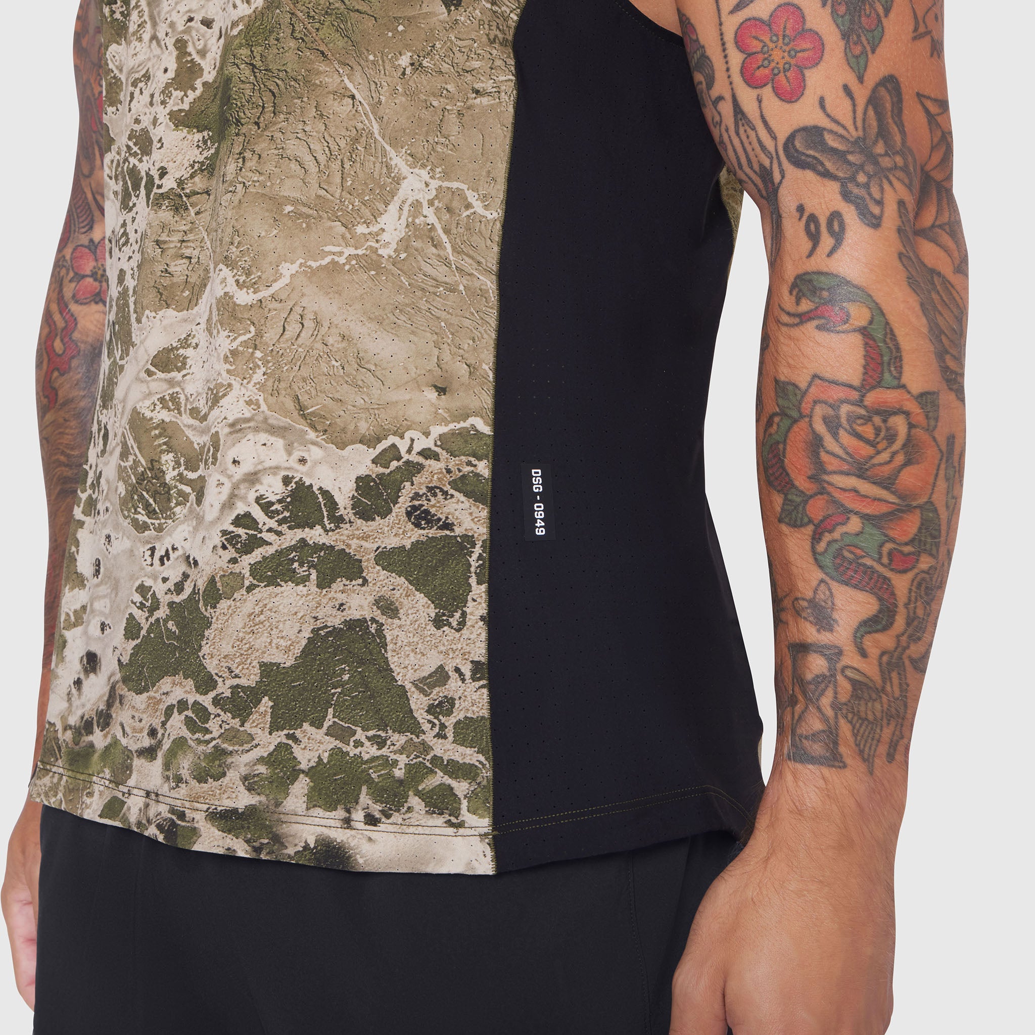 Laser-Vent Singlet Tank in Realtree WAV3 camo, worn by tattooed model, side view