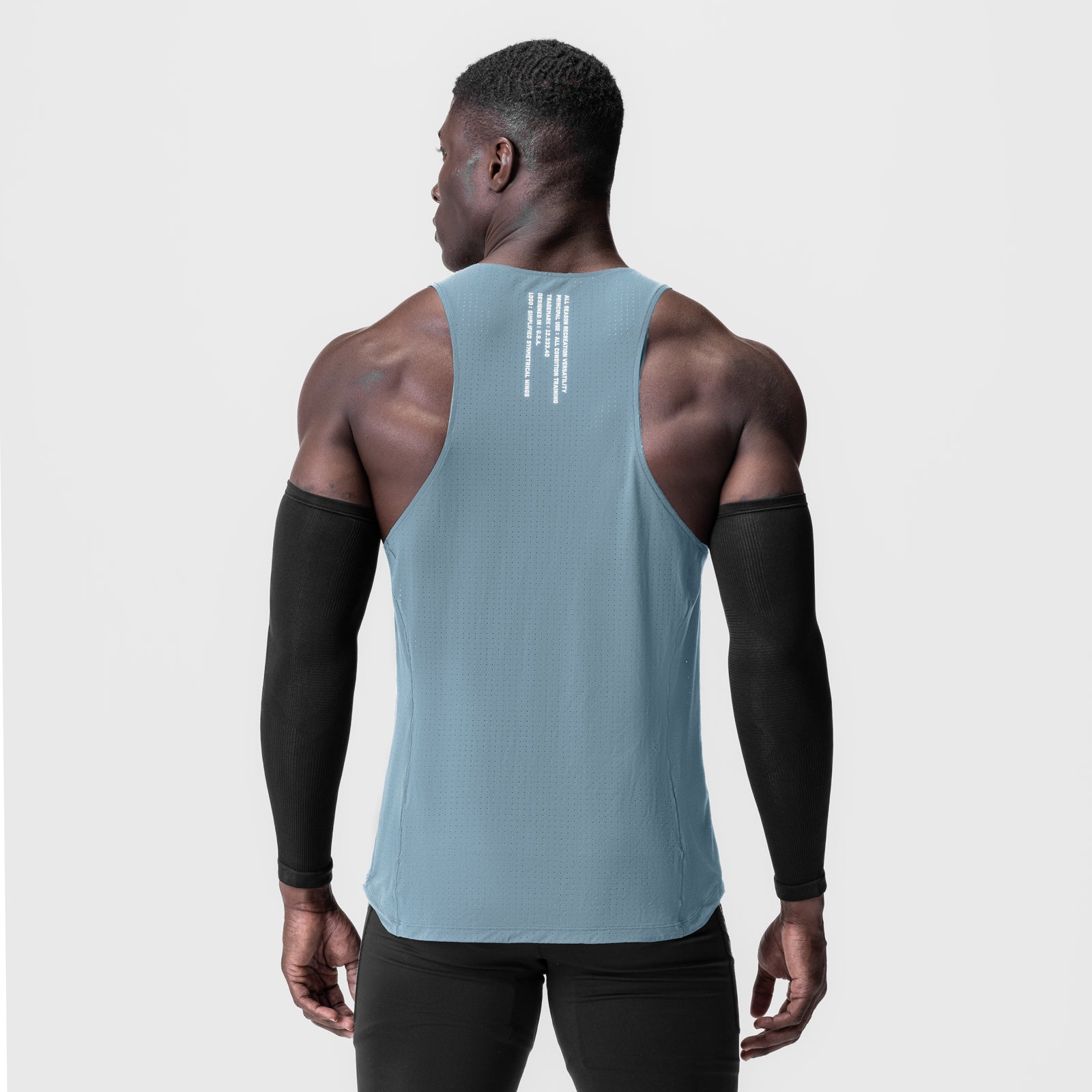 Laser-Vent Singlet Tank in light sky, worn by model, back view