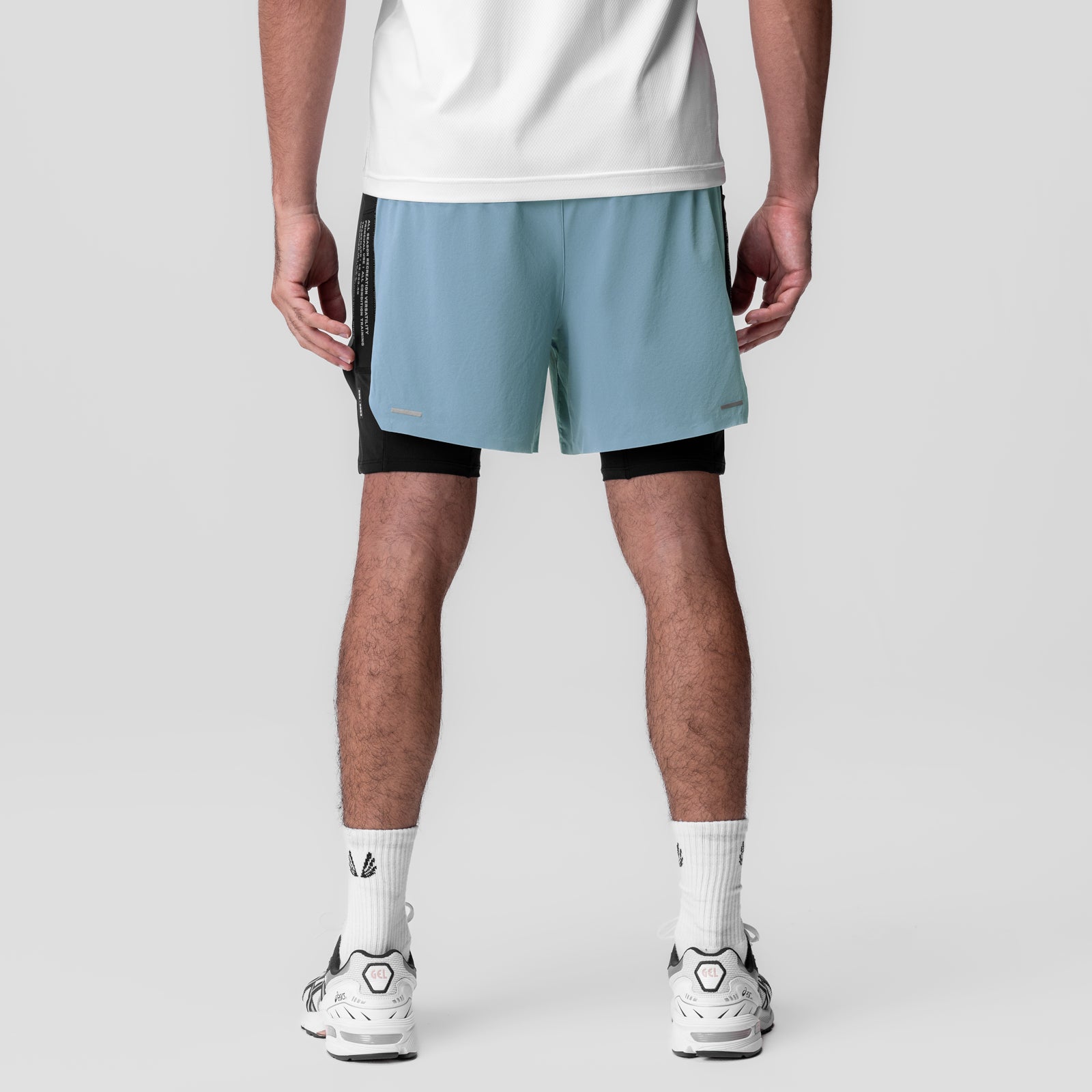 Aerotex Hybrid Liner Short in light sky blue and black, worn by model, back view
