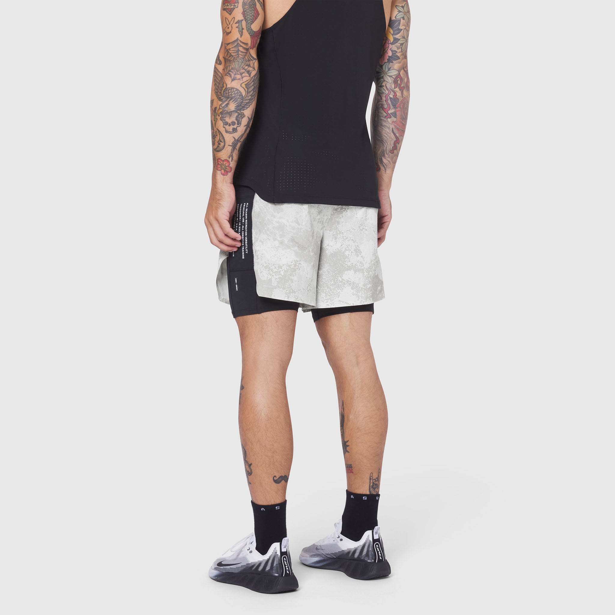 Aerotex Hybrid Liner Short in white camo with black liner, worn by model, side view