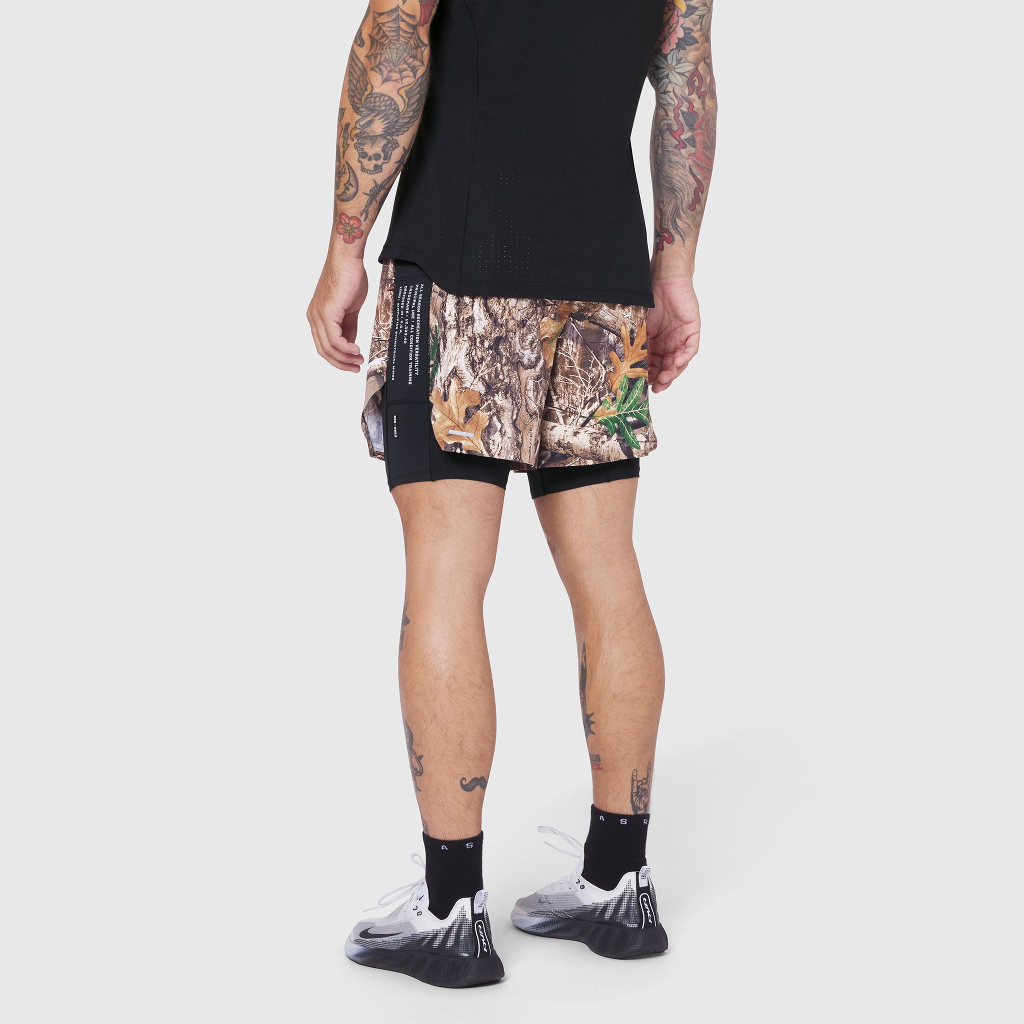 Aerotex Hybrid Liner Short in Realtree Edge camo with black liner, worn by model, back view