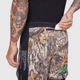 Aerotex Hybrid Liner Short in Realtree Edge camo, worn by model showing side detail