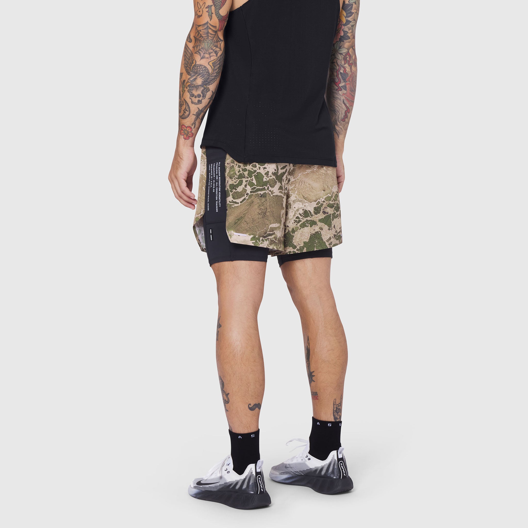 Aerotex Hybrid Liner Short in camo/black, worn by model from behind