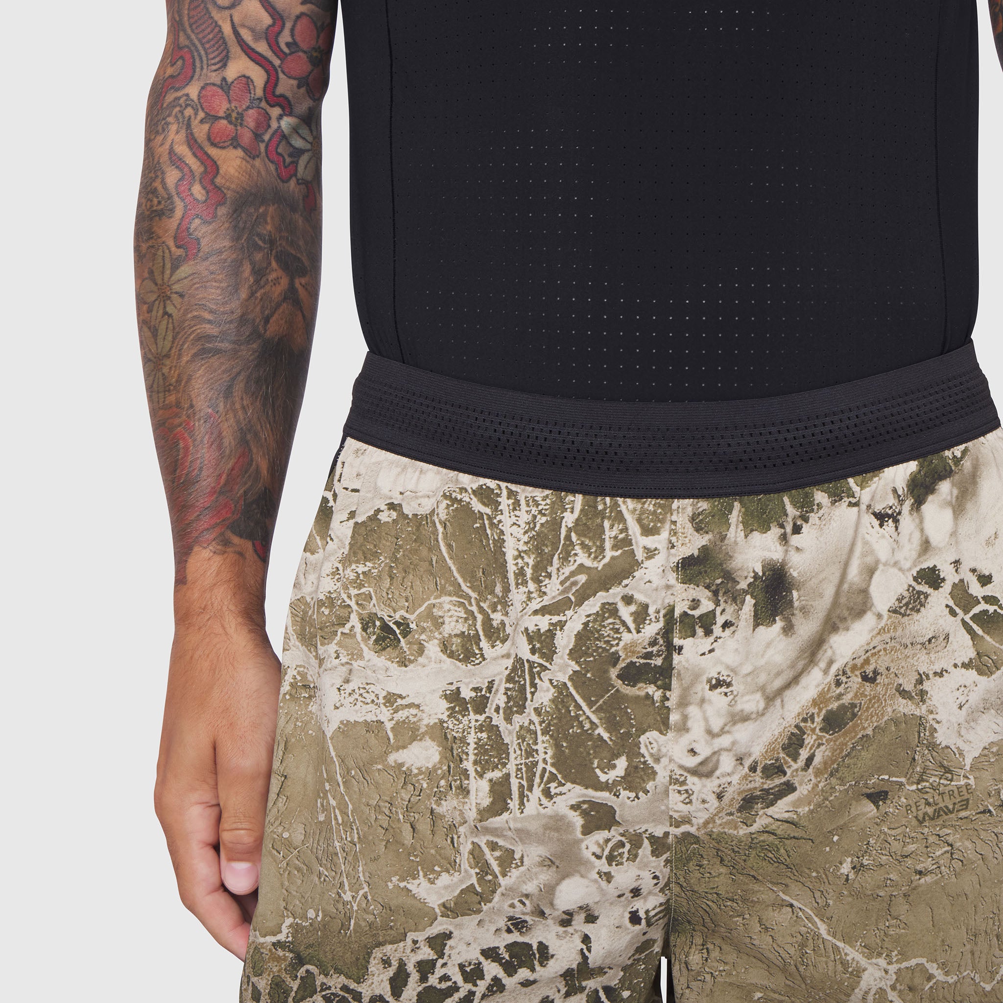 Aerotex Hybrid Liner Short in camo print, worn by model showing side view