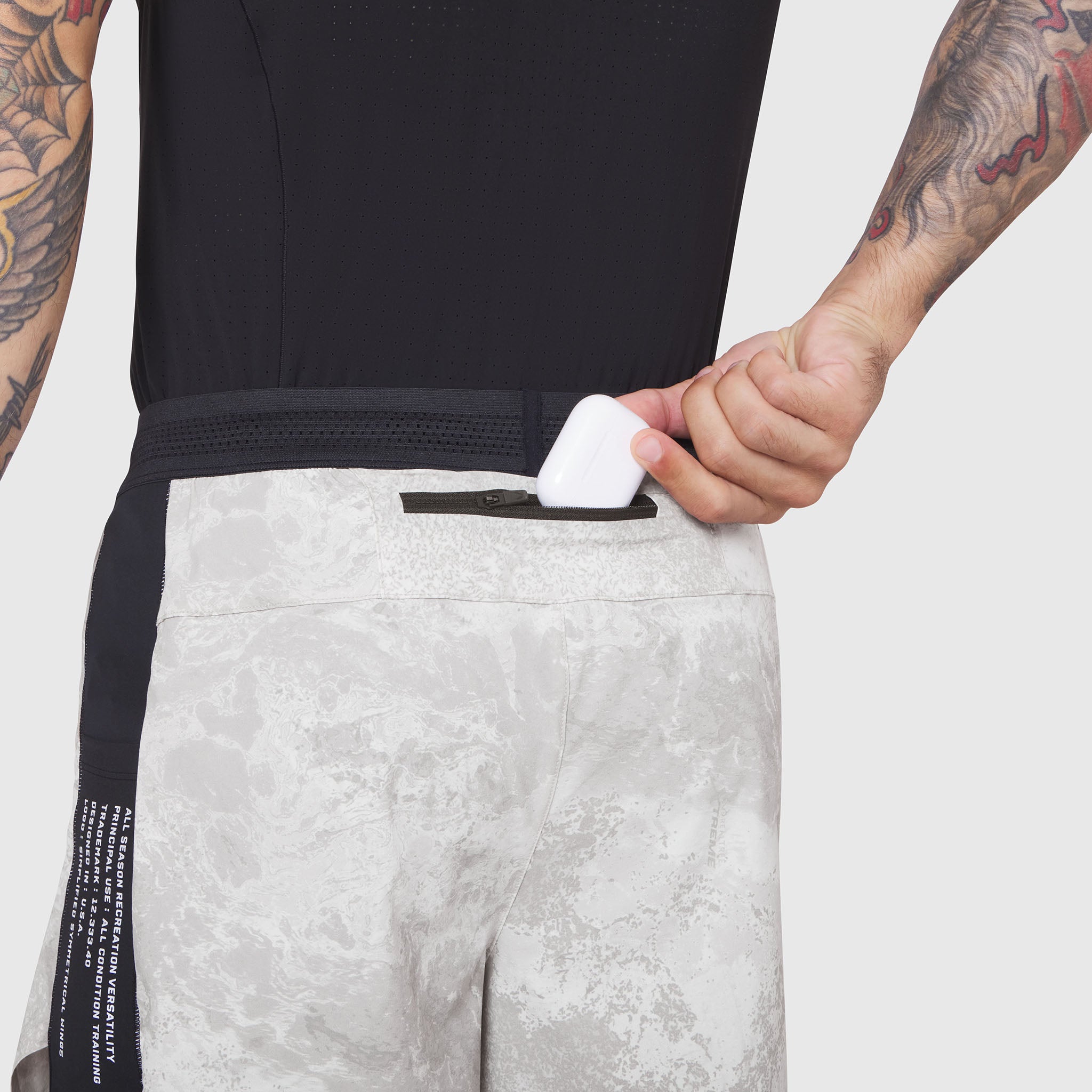 Aerotex Hybrid Liner Short in white camo, model wearing shorts with hand in pocket