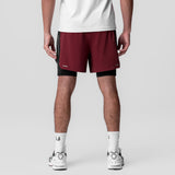 Aerotex Hybrid Liner Short in crimson and black, worn by model from waist down