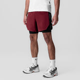 Aerotex Hybrid Liner Short in crimson and black, worn by model, front view